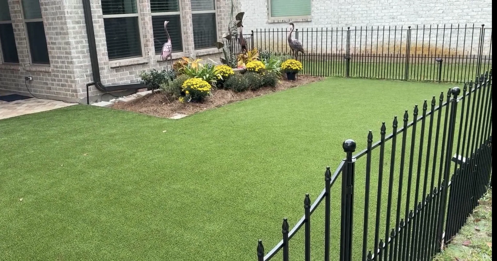 nice backyard area of artificial turf