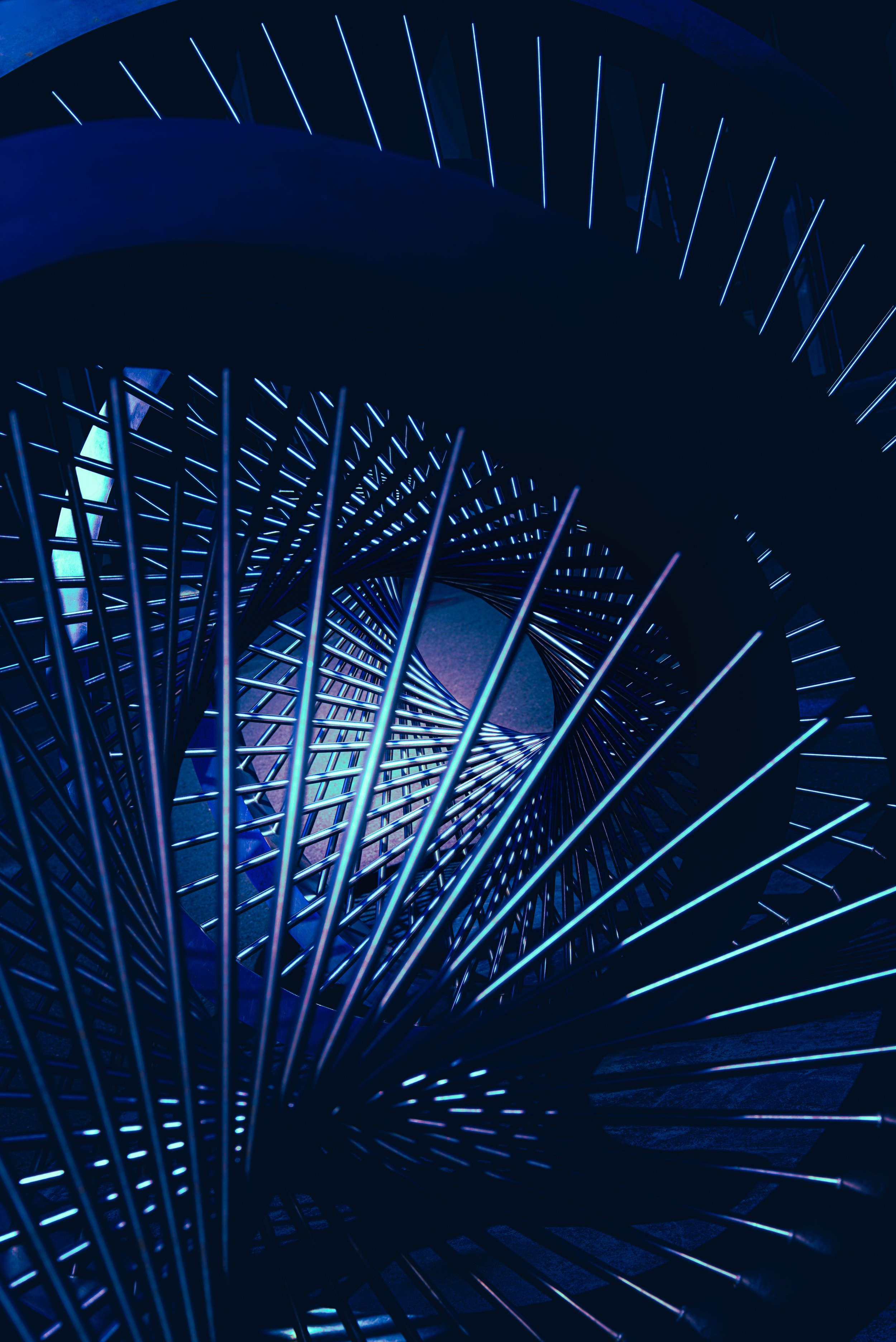 Abstract blue neon light installation with radiating metallic rods and geometric shadows