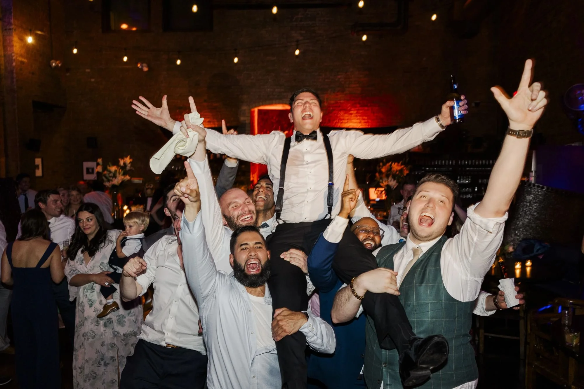 Groom celebrating at NYC wedding reception