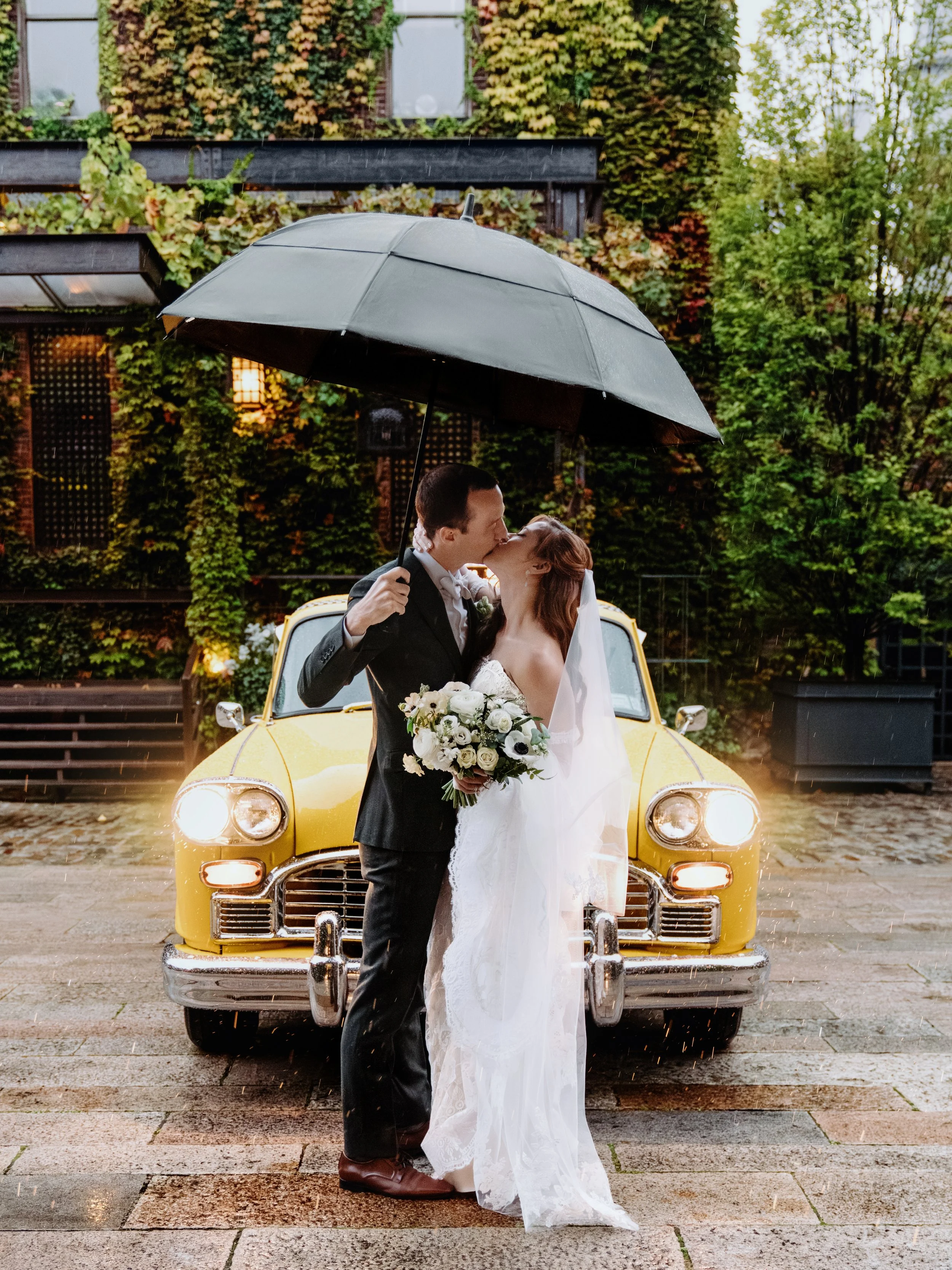 Newlyweds kiss after booking New York wedding package