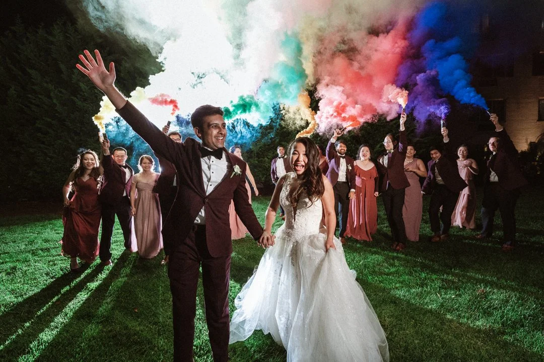 Newlyweds pose with color bombs