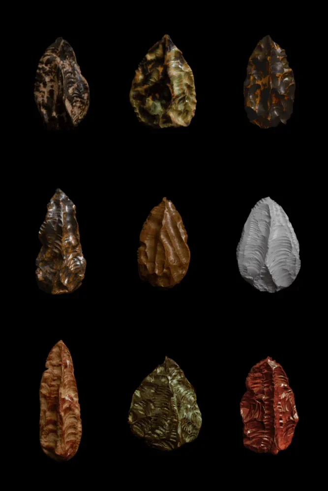 Nine different flint arrowheads arranged in three rows against a black background.