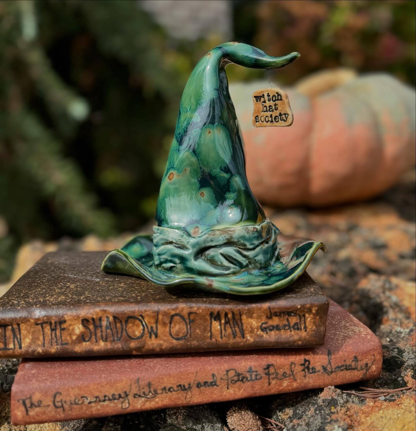 One of the book clubs I belong to call ourselves The Witch Hat Society 🧙&zwj;♀️
This piece will be brought to our annual book exchange party in October which is where we bring a book that is wrapped to share. The books represented here are two of th
