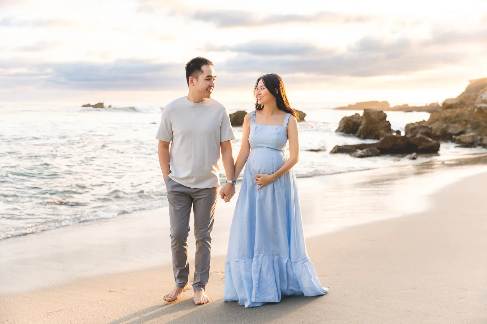 Couple walking along the shoreline at Heisler Park in Laguna Beach, shown as a photoshoot location guide example.