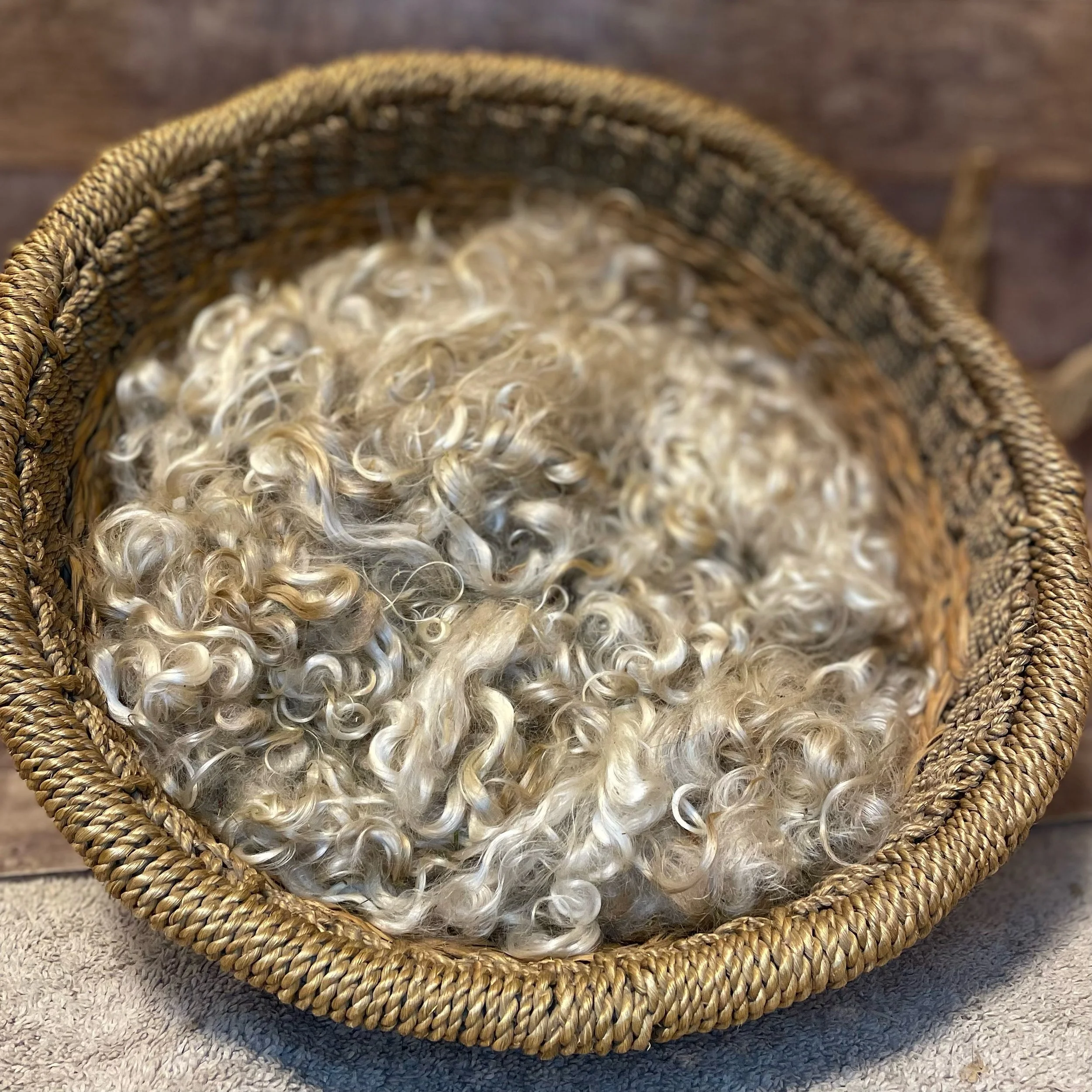 photo of fawn , white and grey mohair in a basket