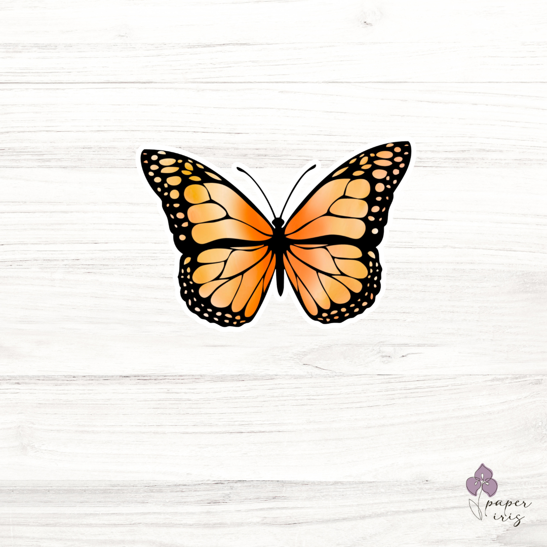 Colorful illustrated stickers on a wooden surface, including a butterfly, flowers in a jar, and a bouquet of daisies.