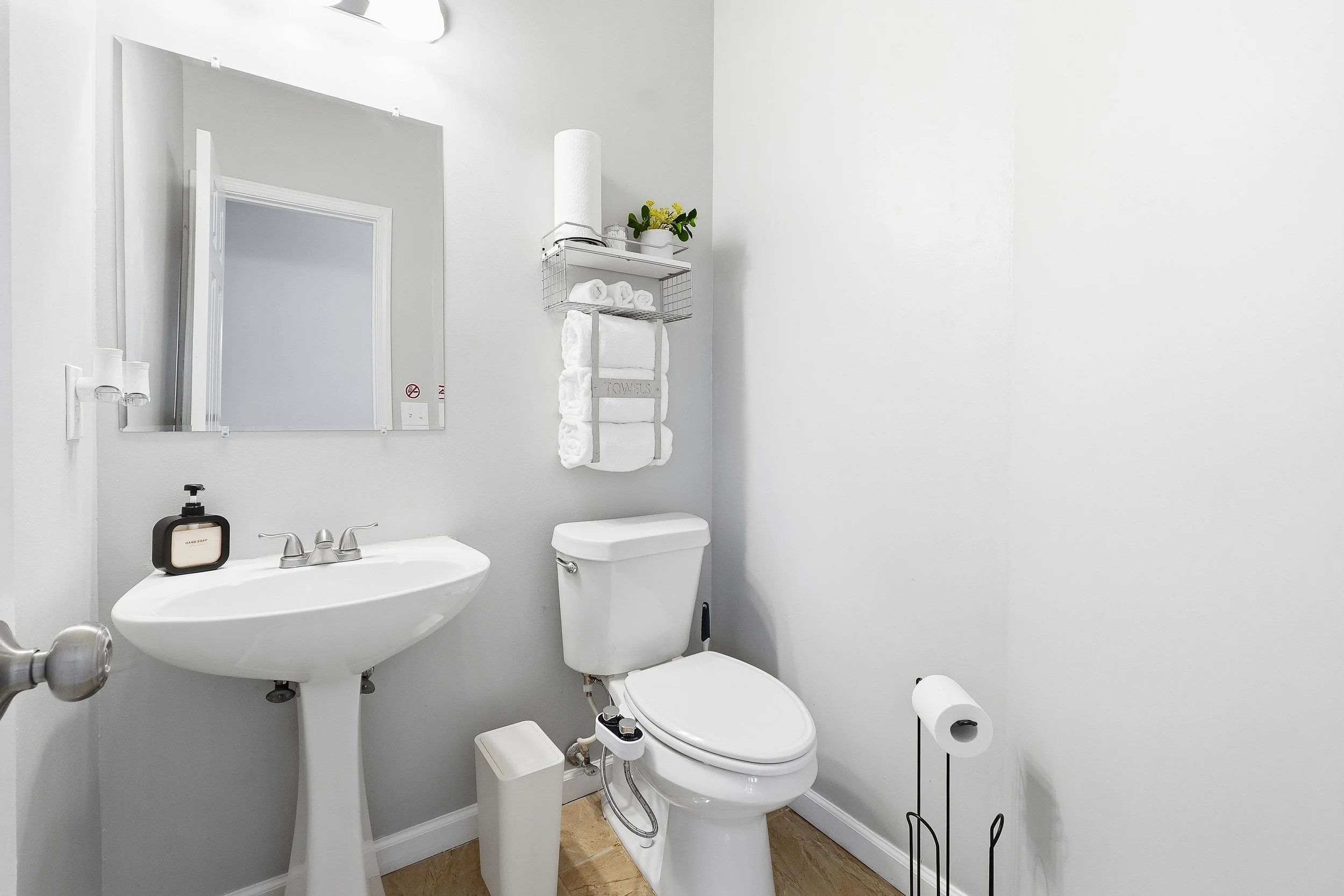 Convenient half bathroom located downstairs for easy guest access.