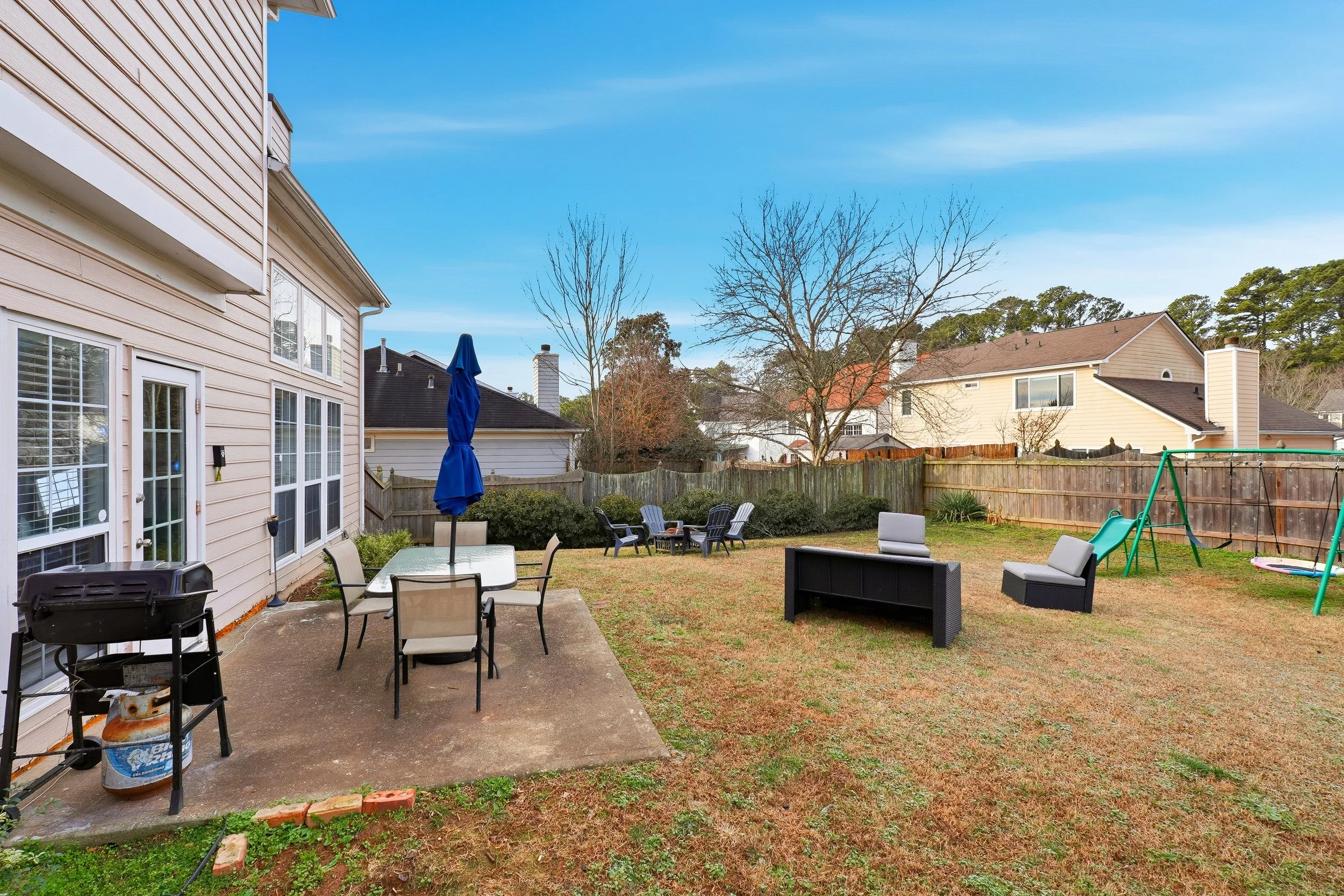 Cook out on the grill or let the kids play on the swing set — a perfect space for family fun and relaxation.