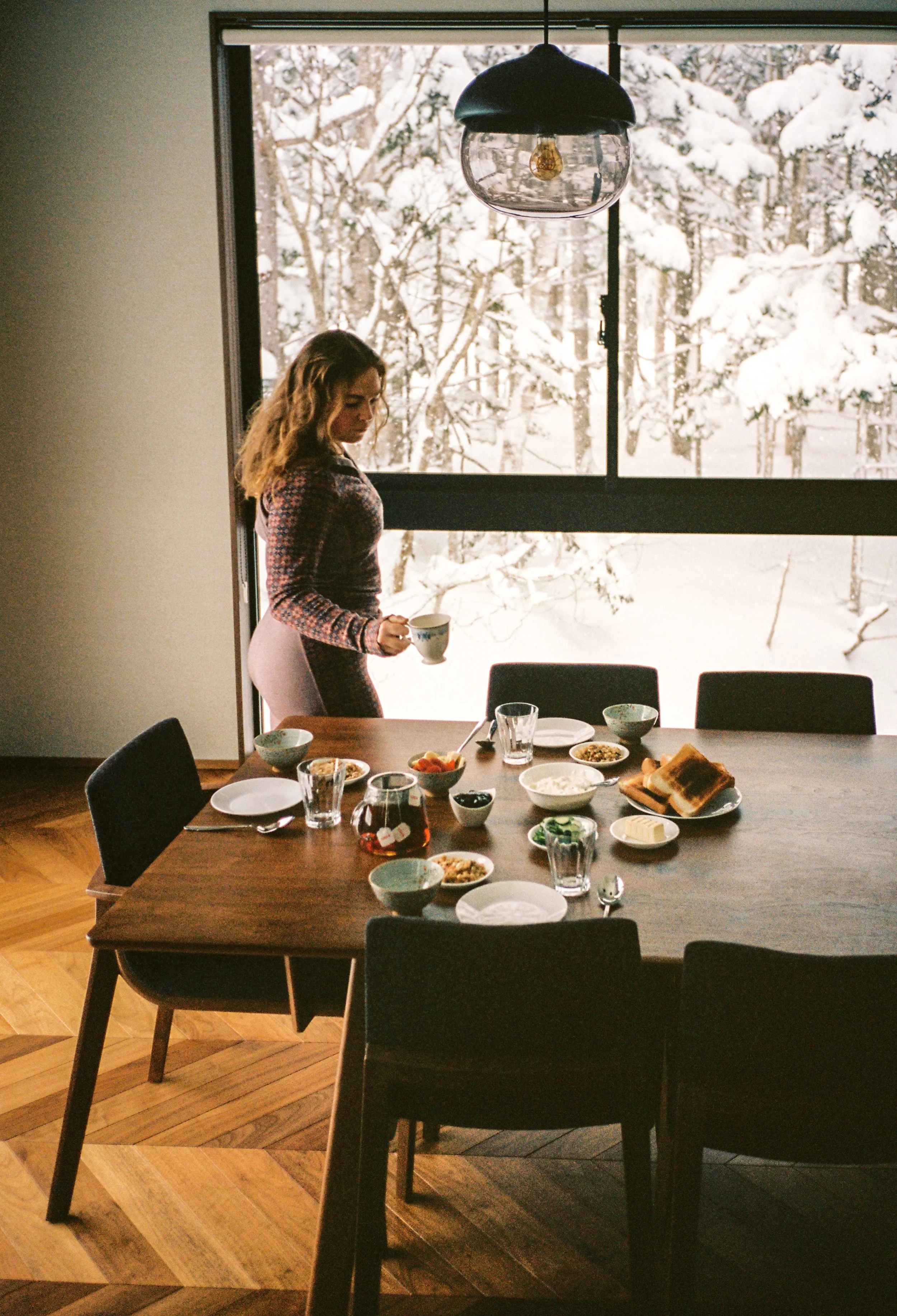 Woman in Dining Area - Jade Rabbit Chalet - Niseko