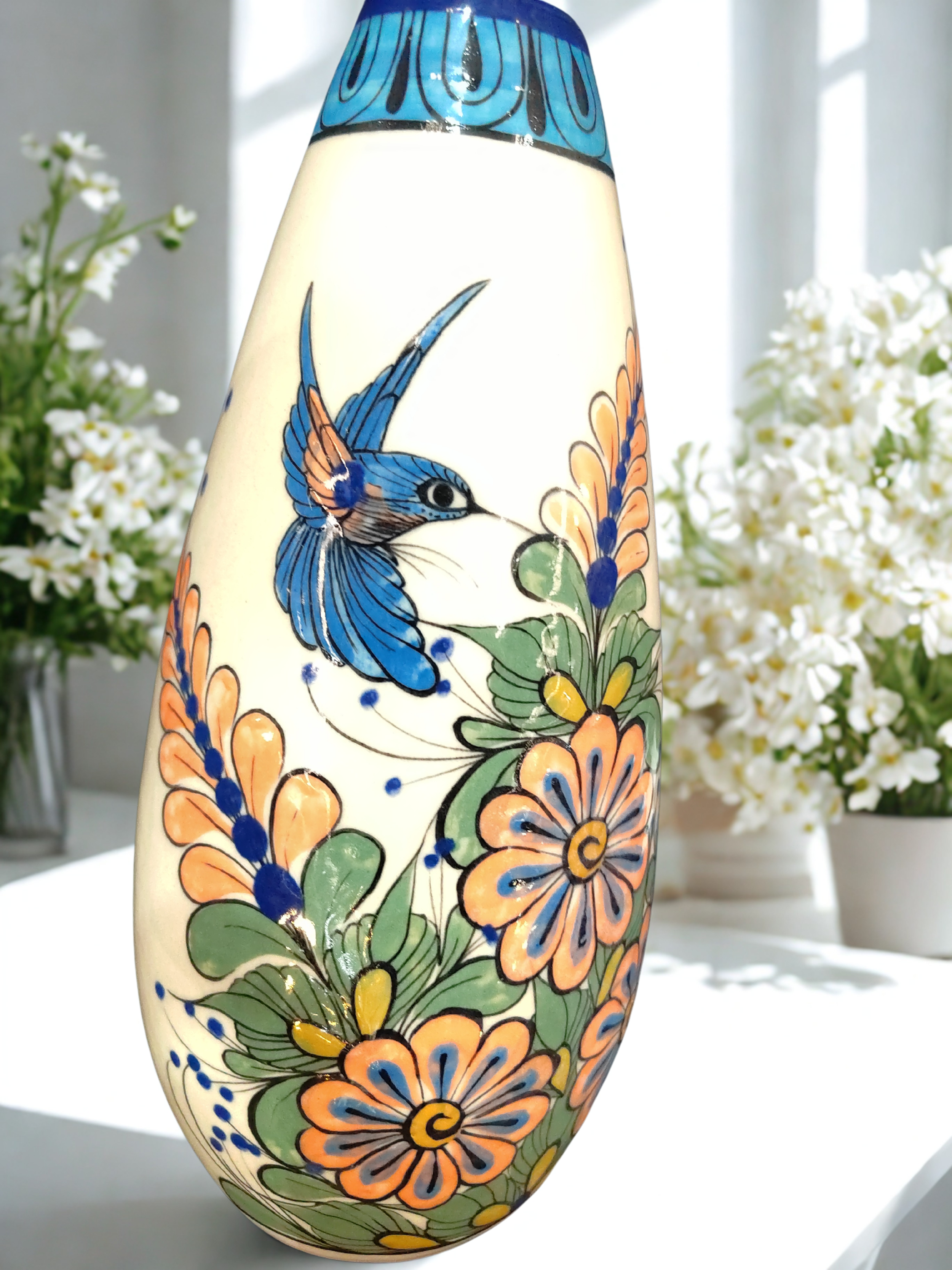 Ceramic vase from Guatemala with toucans and hummingbirds handpainted all around
