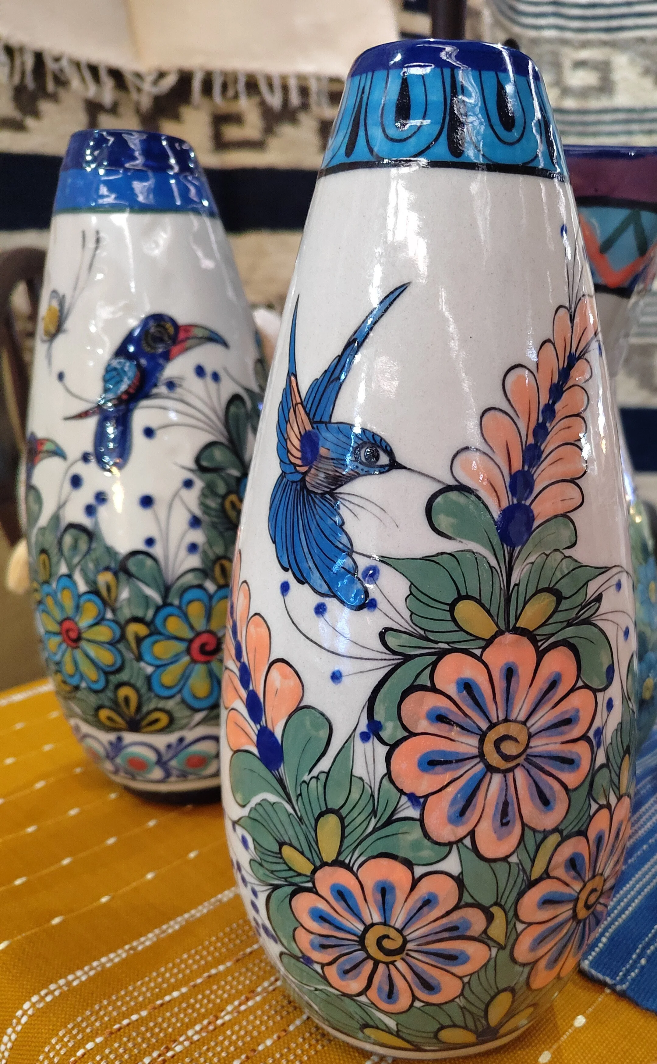 Ceramic vase from Guatemala with toucans and hummingbirds handpainted all around