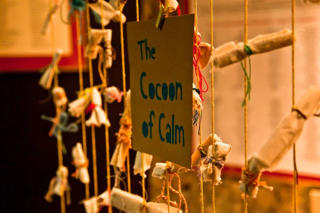 Worries were written down onto pieces of fabric by young people, then rolled up and tied together to transform them into something positive - the cocoon of calm
