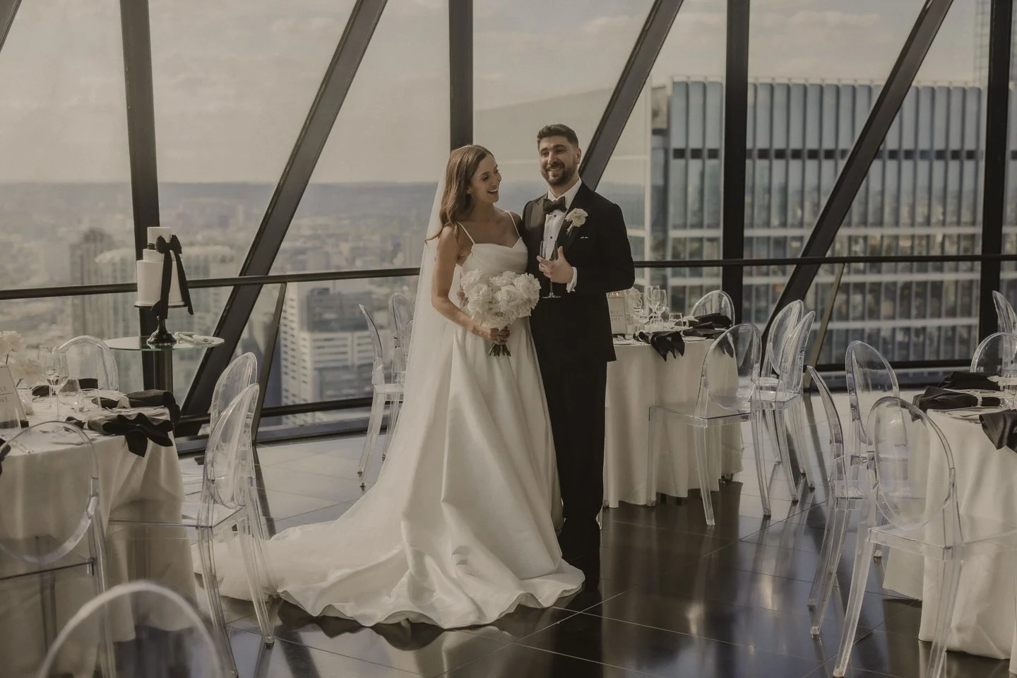 Bride and groom overlooking the London skyline at an editorial city wedding