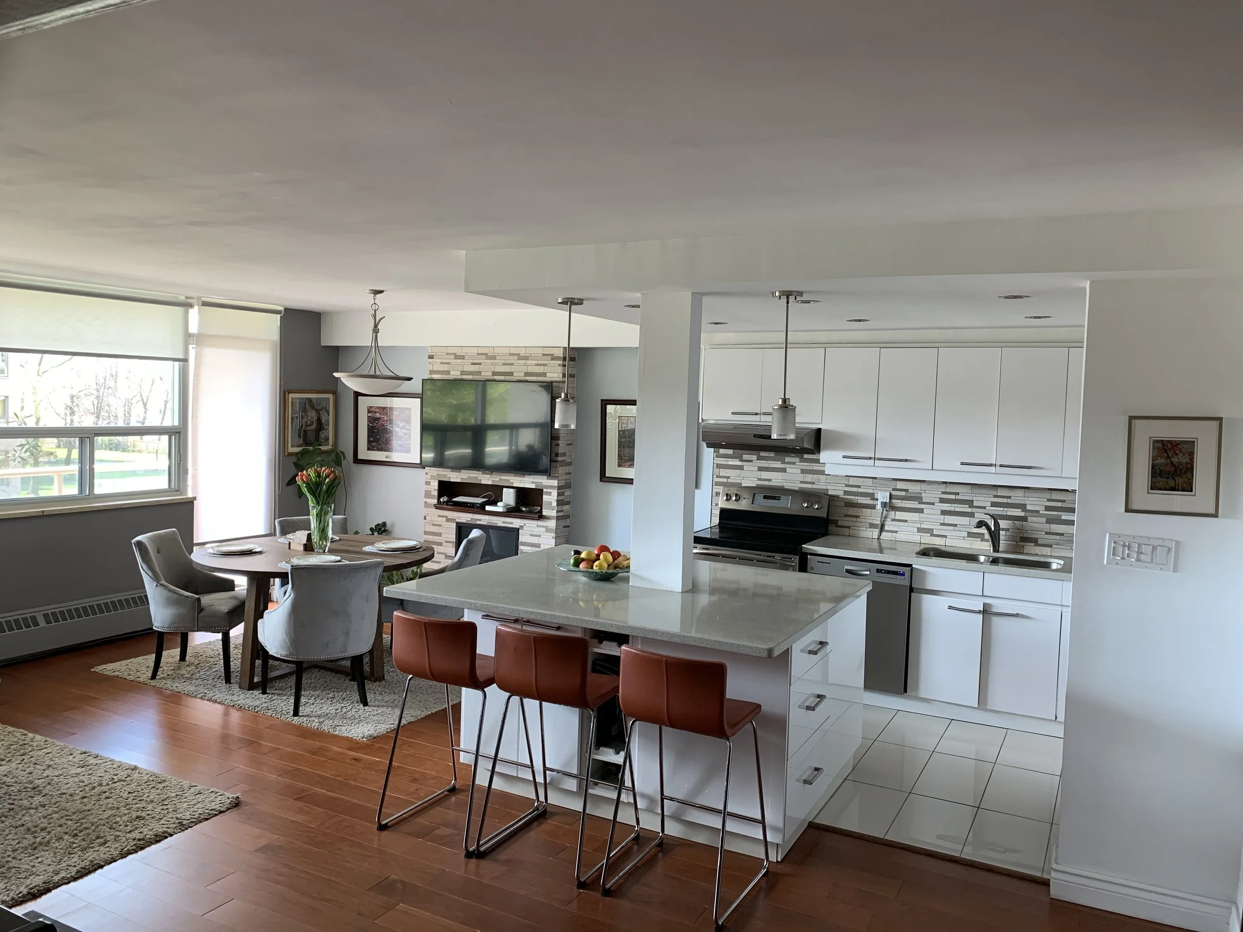 Renovated apartment with an open kitchen concept and brown wooden flooring