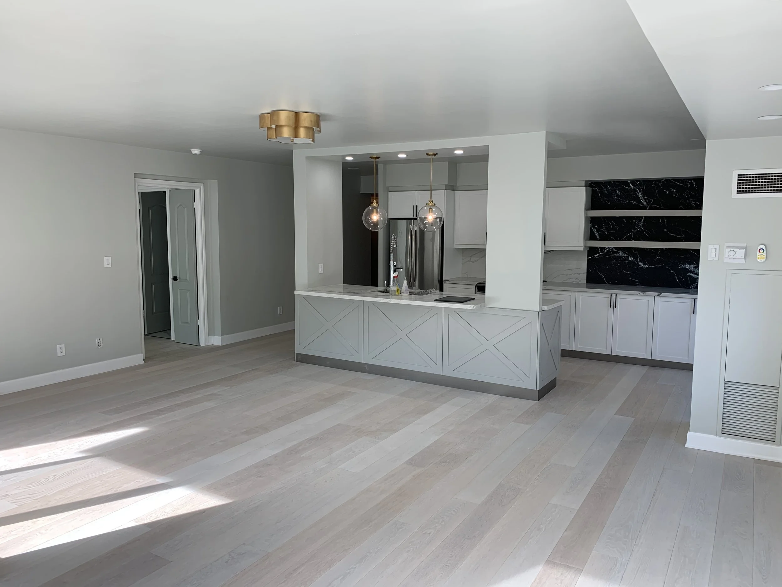 The finished kitchen before adding furniture of a condo renovation