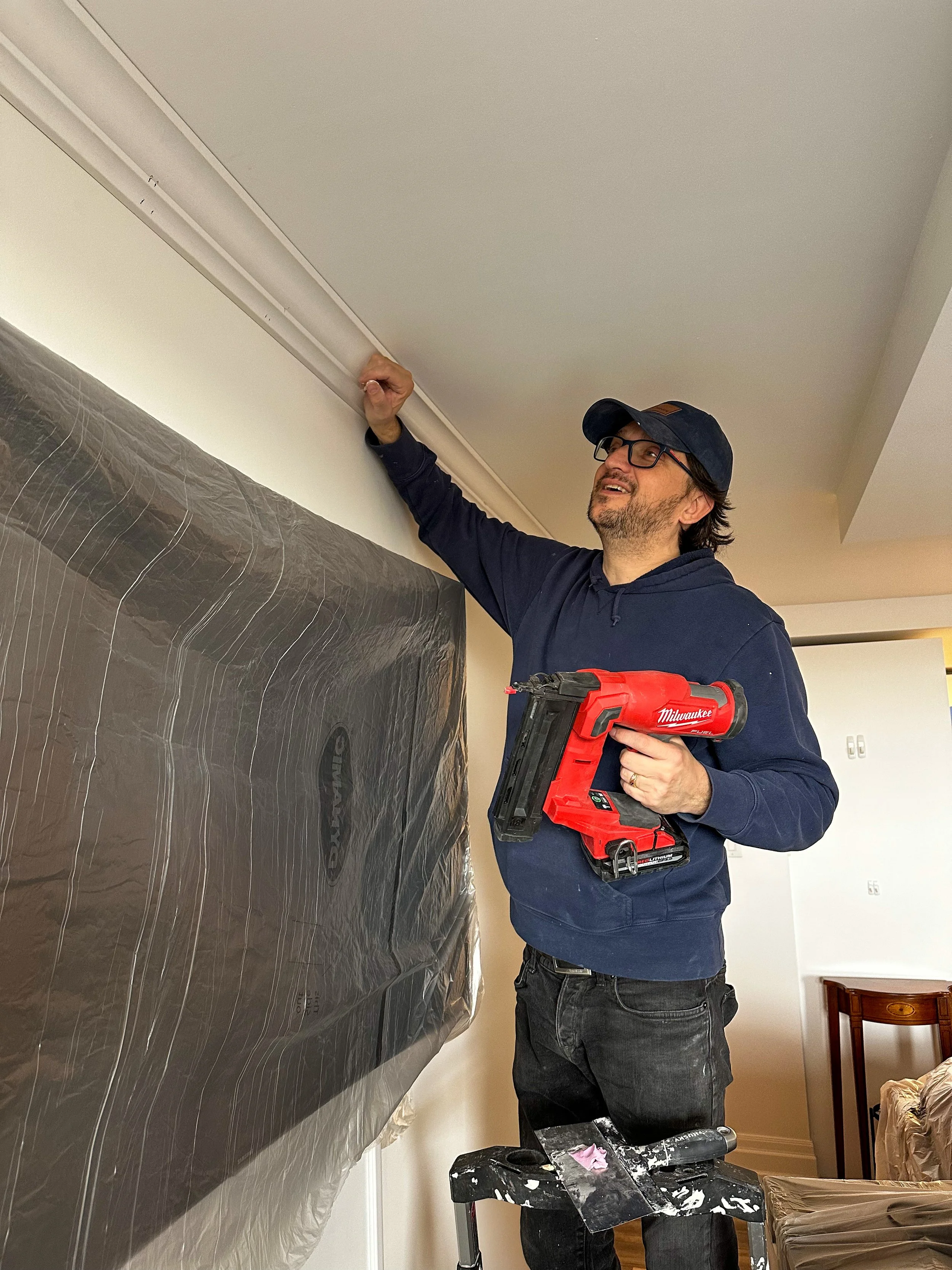 Crown mouldings being installed