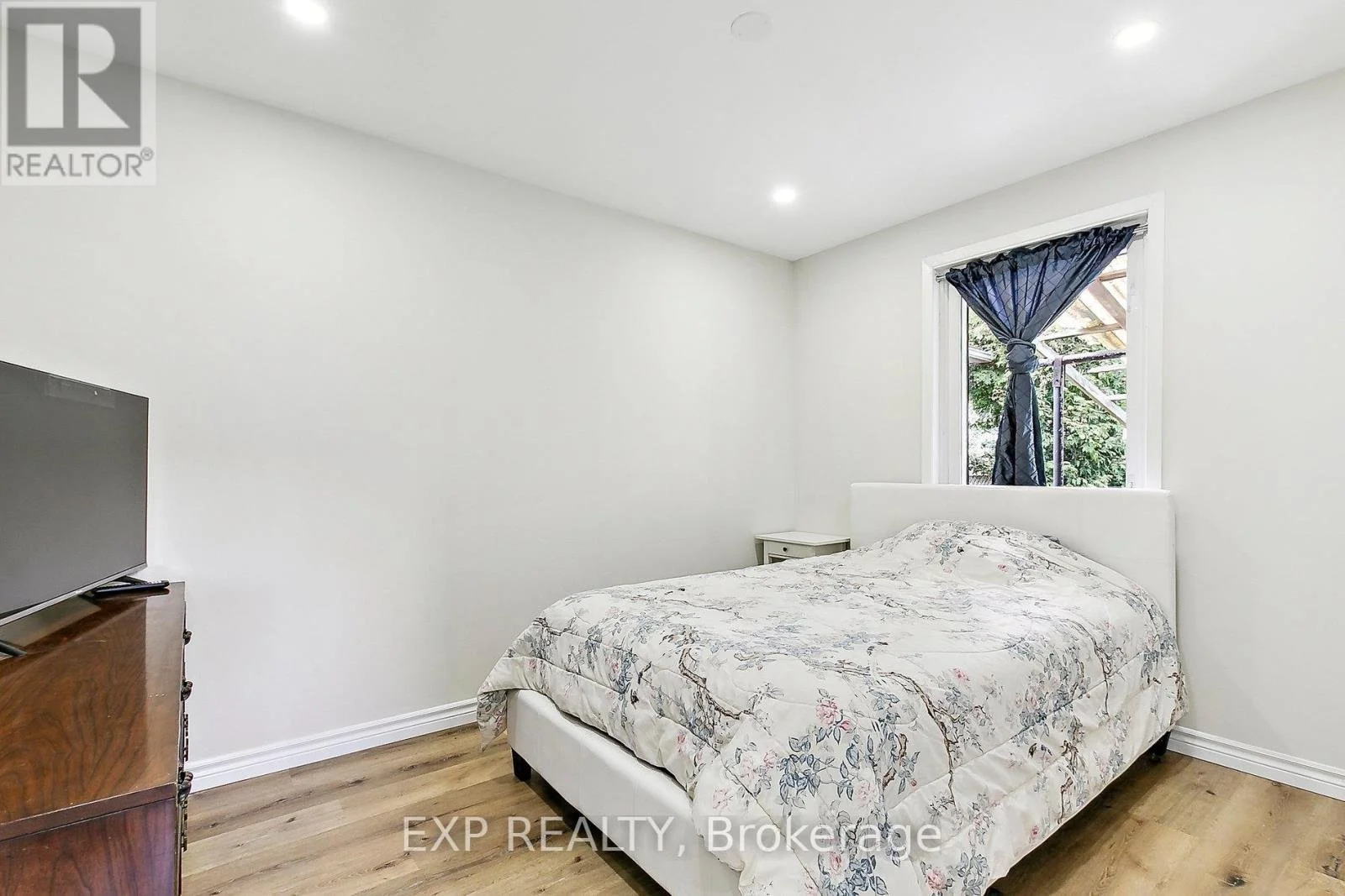 Renovated bedroom with bed