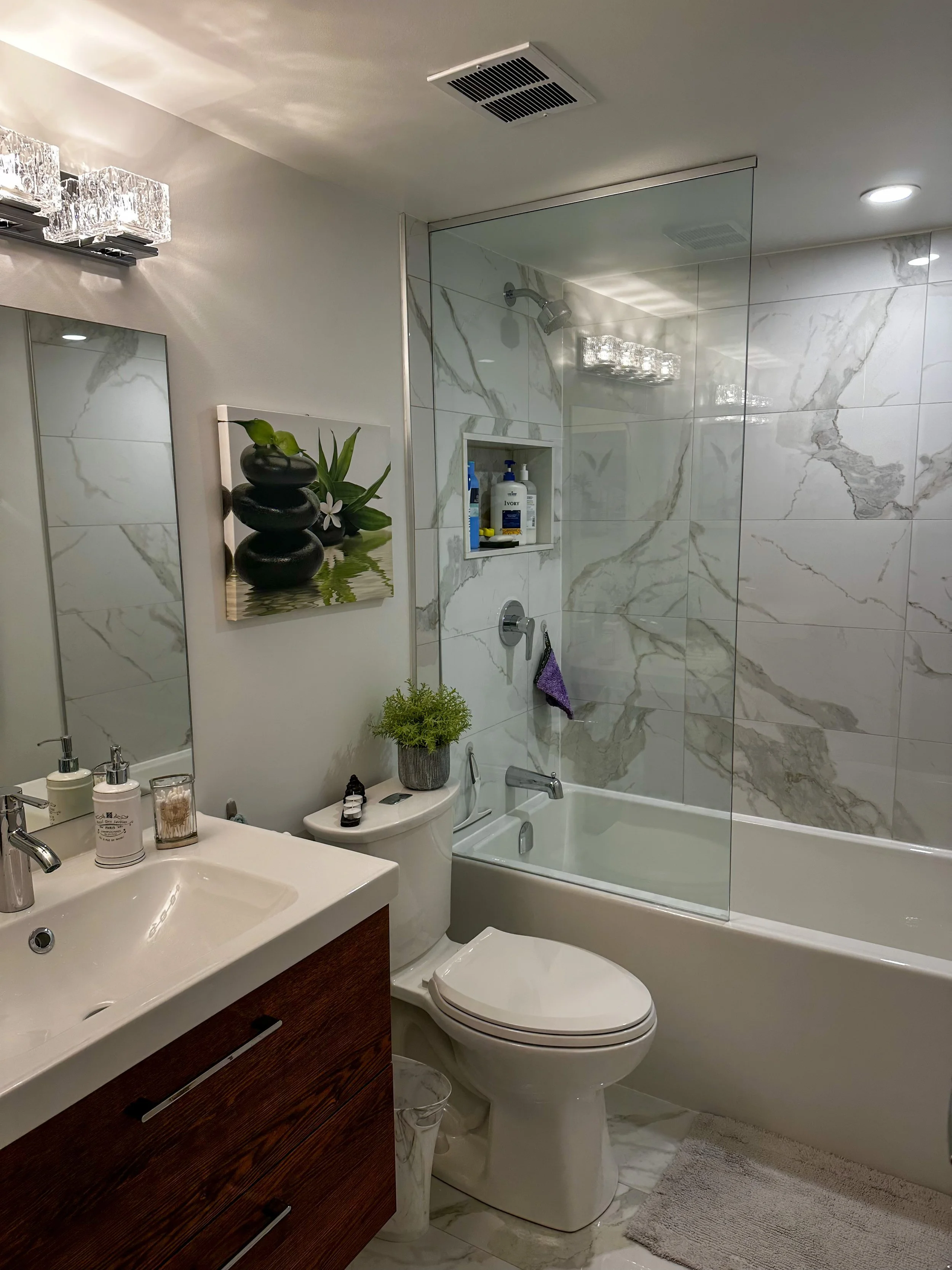 Freshly painted modern bathroom with white tiles.