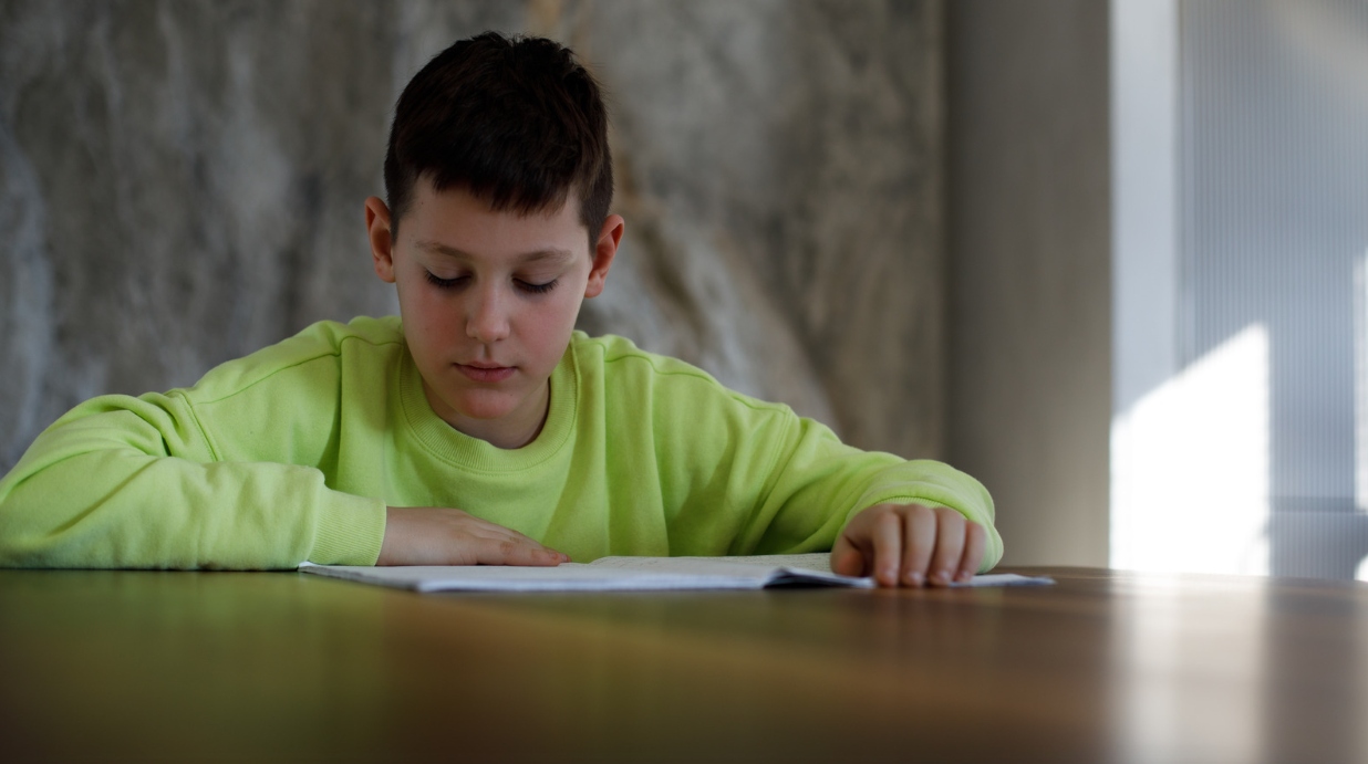 8 year old boy reading.