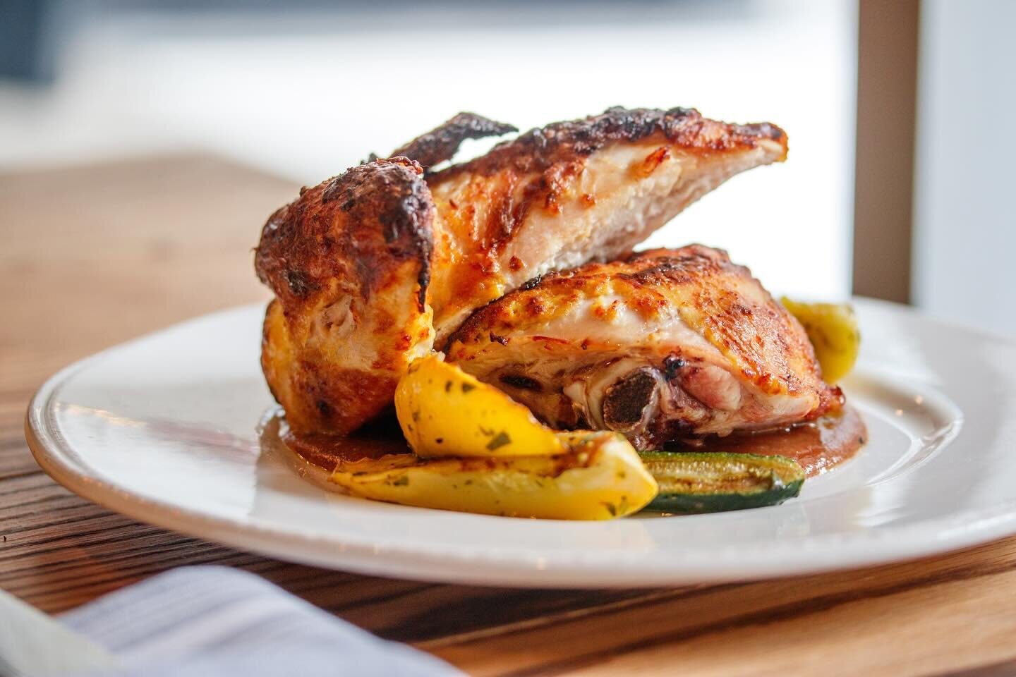 Experience culinary excellence at Deacon&rsquo;s New South with our Roasted Heritage Chicken, prepared tandoori style and served with seasonal summer squash and our delectable Jezebel sauce. 🍗✨ As a restaurant known for our premium dry-aged steaks, 