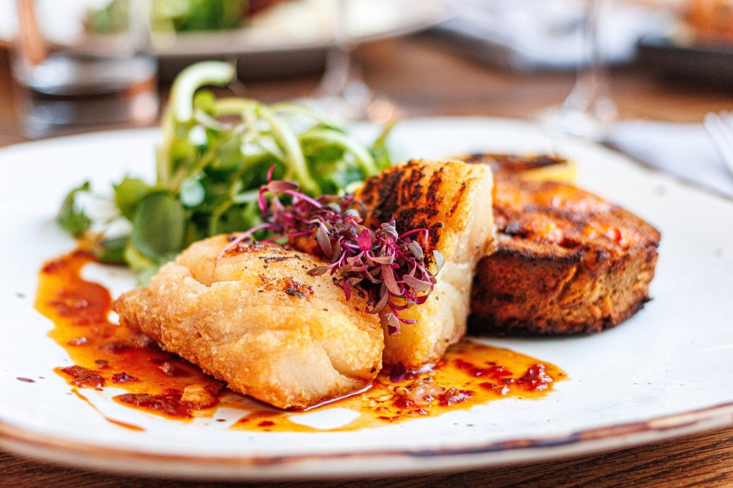 Our Pan Seared Gulf Market Fish is served with baby bok choy, crawfish brown butter and Szechuan demi for a balanced, flavor-forward dish at Deacon&rsquo;s. Reserve your table and join us for your next dinner out.