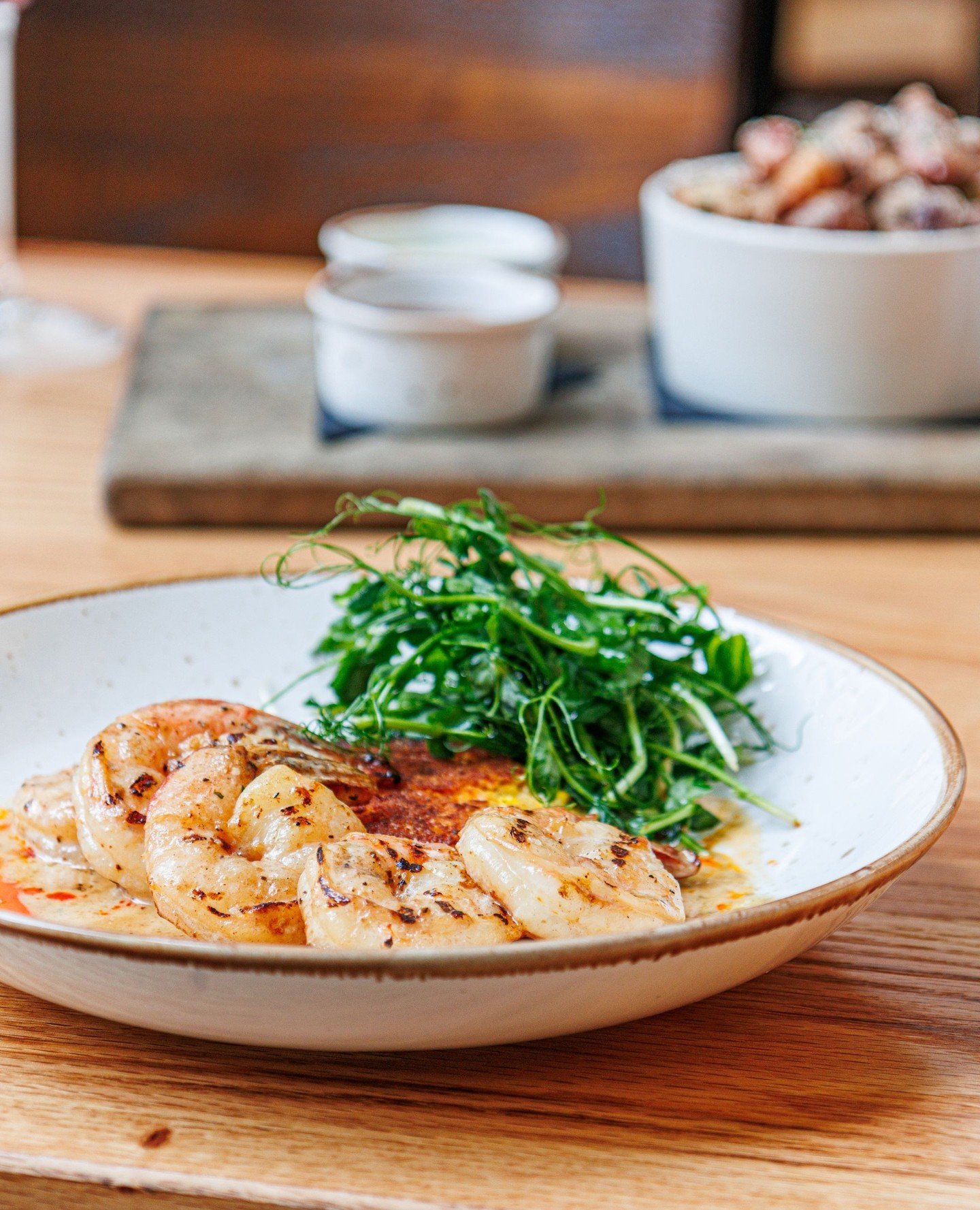 Our seasonal dishes have arrived. Swipe for a few of our favorite new menu items, including: BBQ Shrimp, Berkshire Tomahawk Pork Chop, Chilled Crab Cake, Strawberry Arugula Salad, Cr&egrave;me Br&ucirc;l&eacute;e, or Hummingbird Cake - just to name a