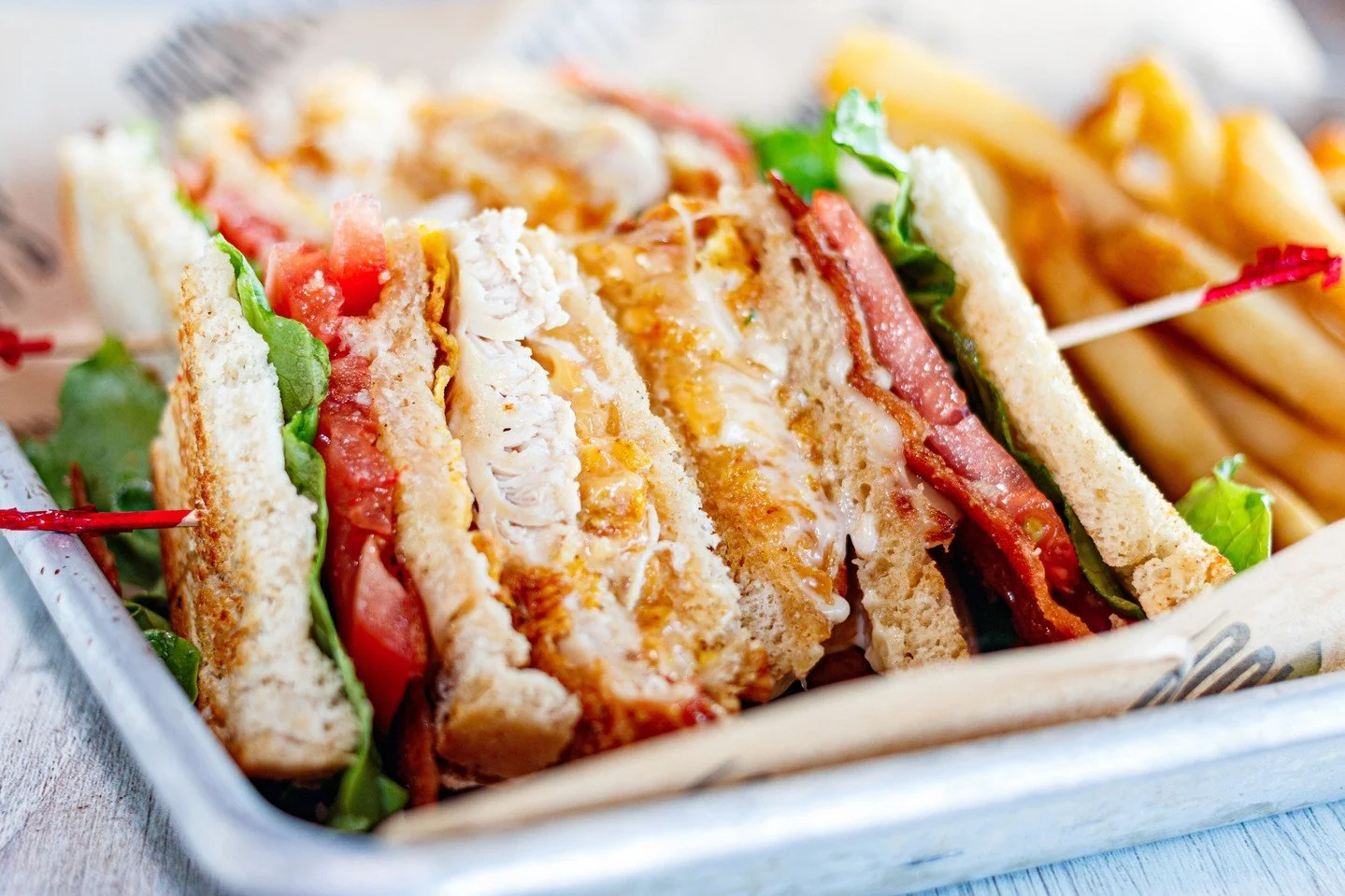 Crispy chicken, fresh tomato, and oh-so-Southern pimento cheese. That's how we do Sandwich Day🥪✨⁠
⁠
#NationalSandwichDay #FriedChickenClub #Clubsandwich