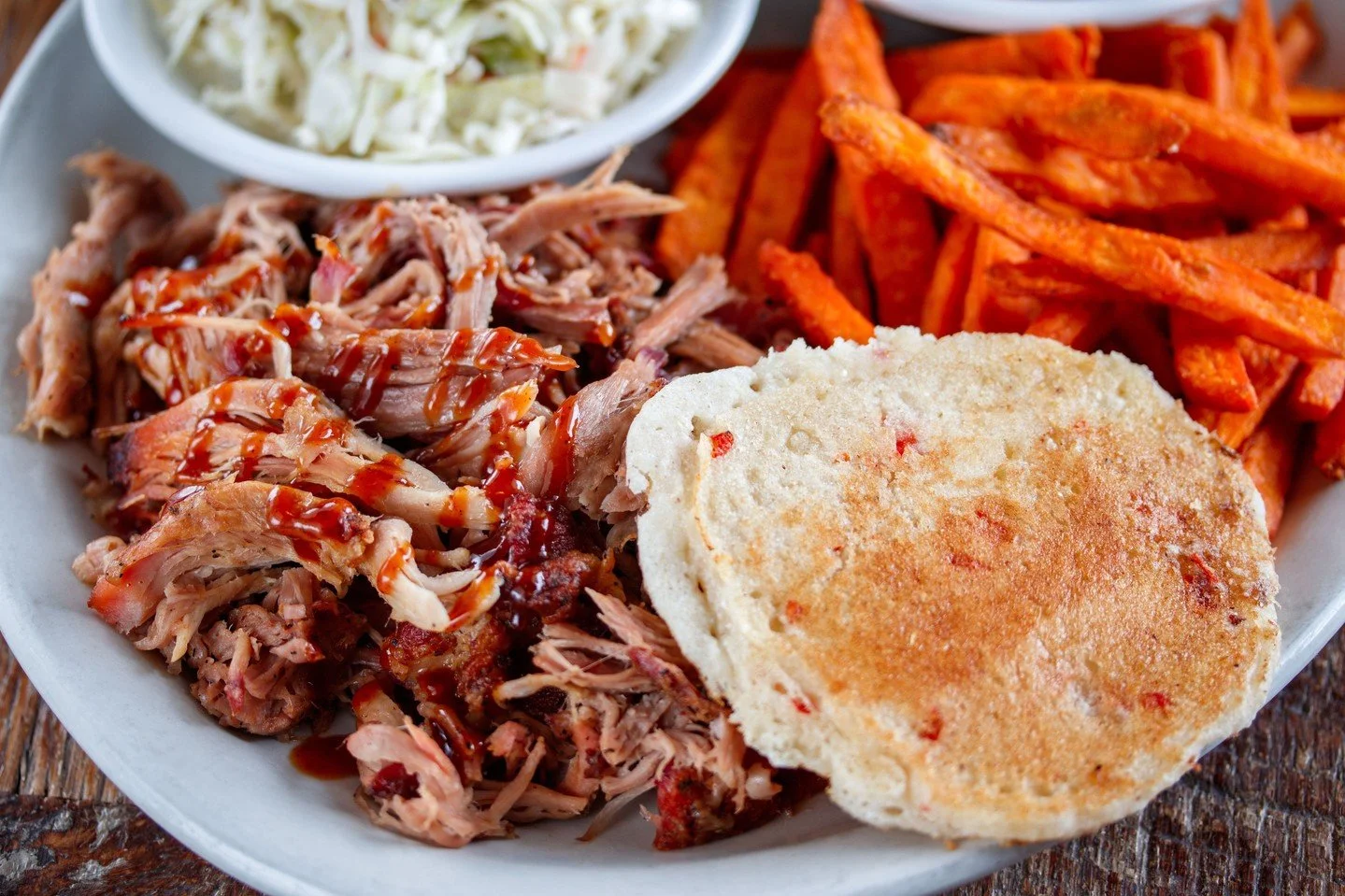 BBQ lovers rejoice!⁠
⁠
Today is National BBQ day, and what better way to celebrate than swinging by your local Puckett's and grabbing some of our delicious cherry wood-smoked pulled pork. Or grab a rack of ribs (that's right they're BACK) and get you