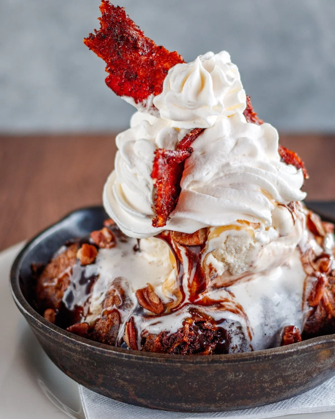 One spoonful in and you'll get it. 🍫

The Deep Fried Brownie Sundae brings together a deep-fried fudge brownie, Hattie Jane's vanilla ice cream, toasted pecans, candied bacon and plenty of chocolate and caramel.