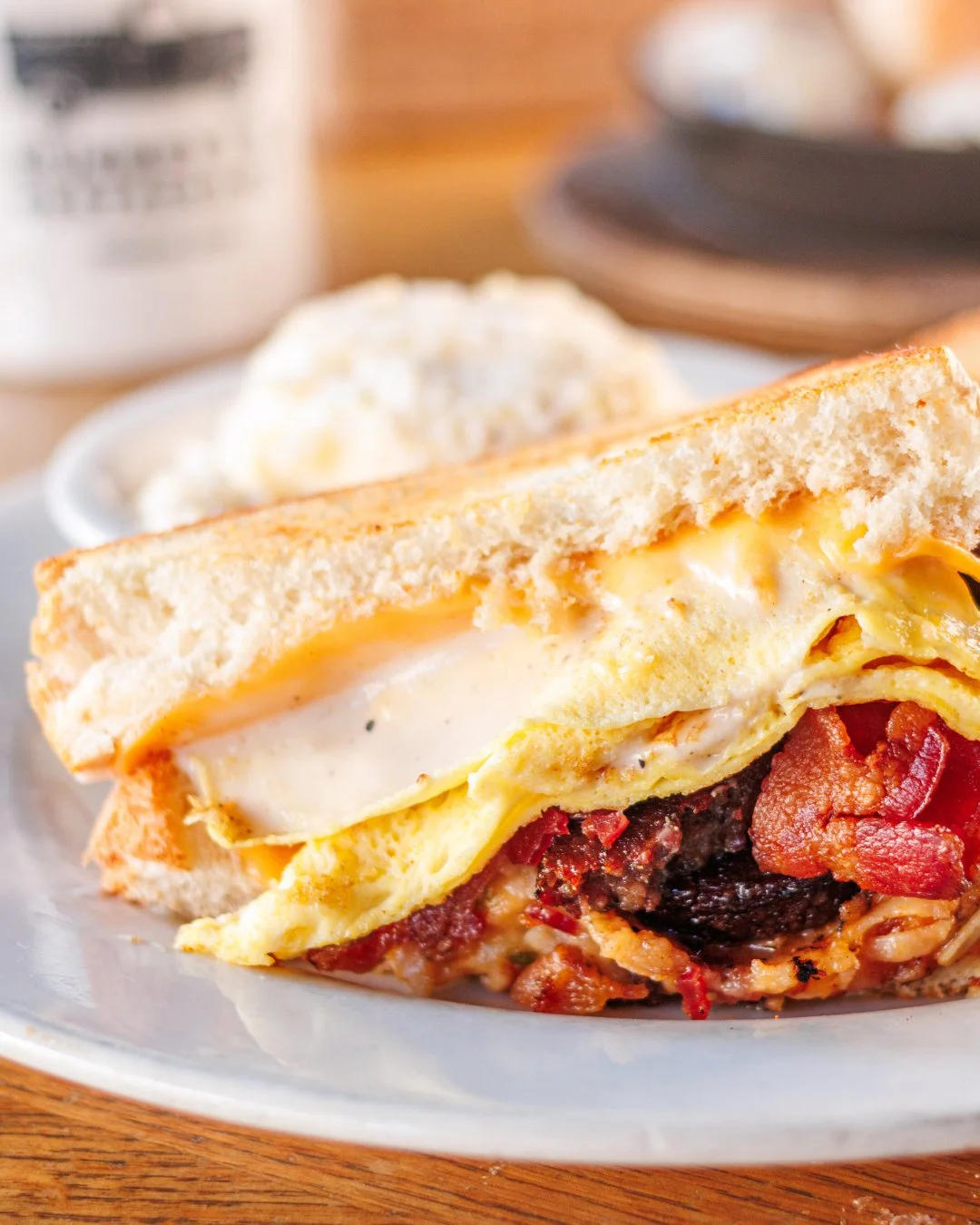 Start your morning with the Farmboy Breakfast Sandwich, stacked with bacon, sausage, egg, American cheese, hashbrown casserole, white pepper gravy and served with white cheddar grits.

Breakfast is served daily from 7&ndash;11 a.m. 🍳