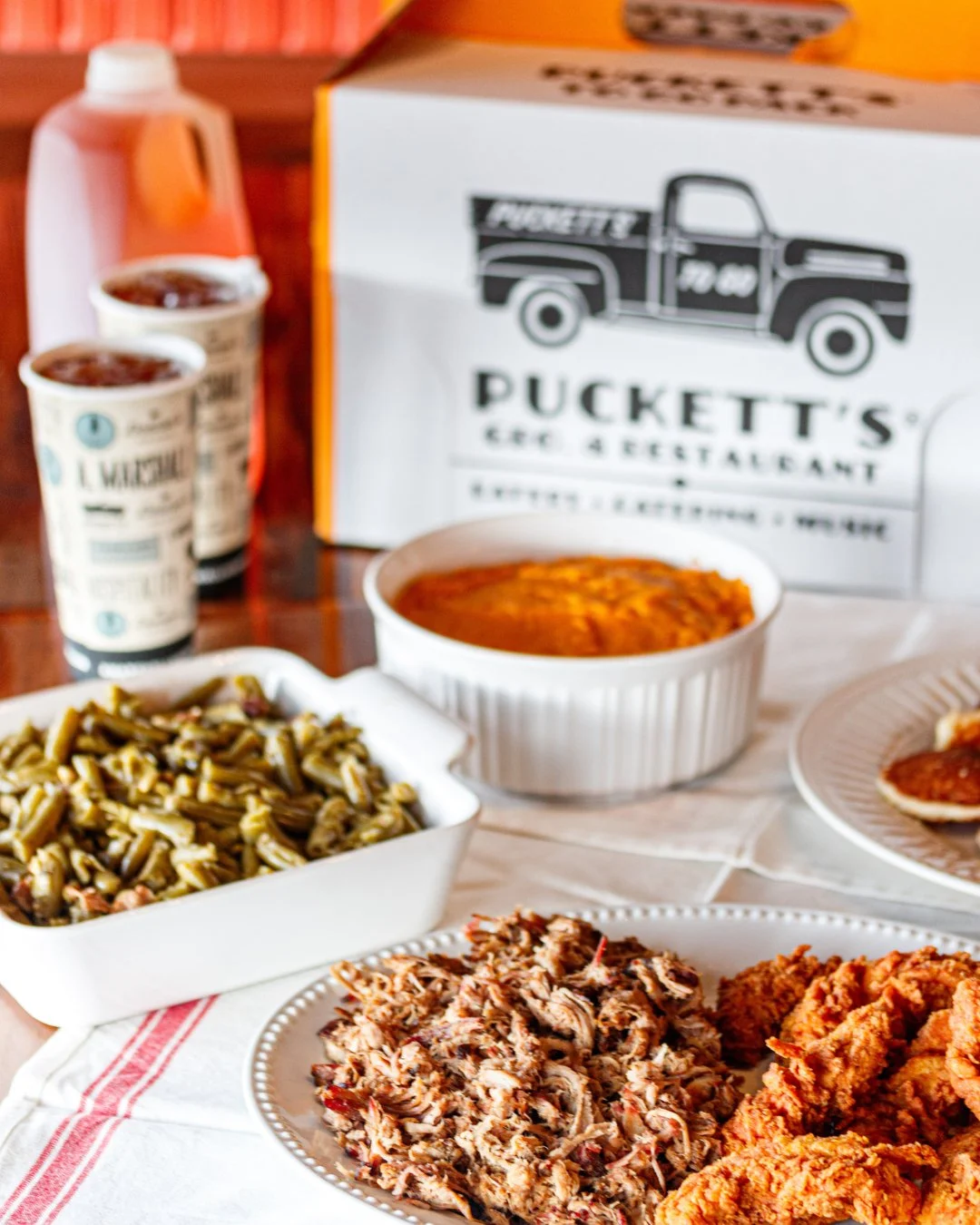Skip the cooking and pick up a Puckett&rsquo;s To Go Pack, served hot and ready for wherever the long weekend takes you. 🍖

For $54.99, get two lbs. of meat, two quart-sized sides, a dozen Cajun Corncakes, Original and Spicy BBQ sauces, plus butter 