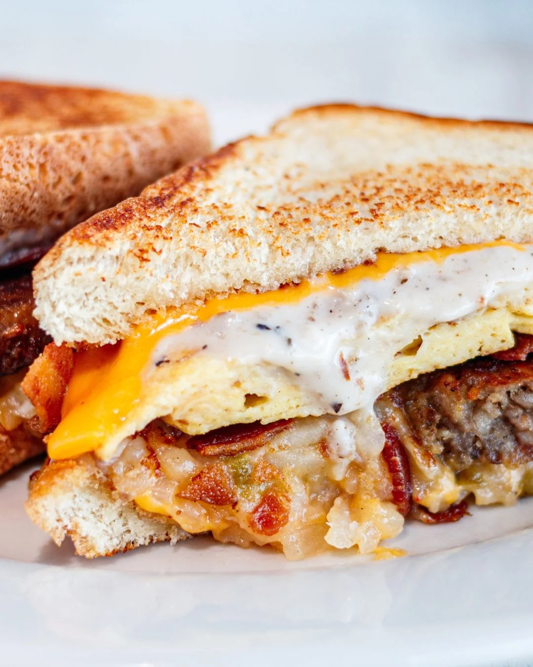 Yes, there's hashbrown casserole on the sandwich. Don't knock it 'til you try it! 🍳