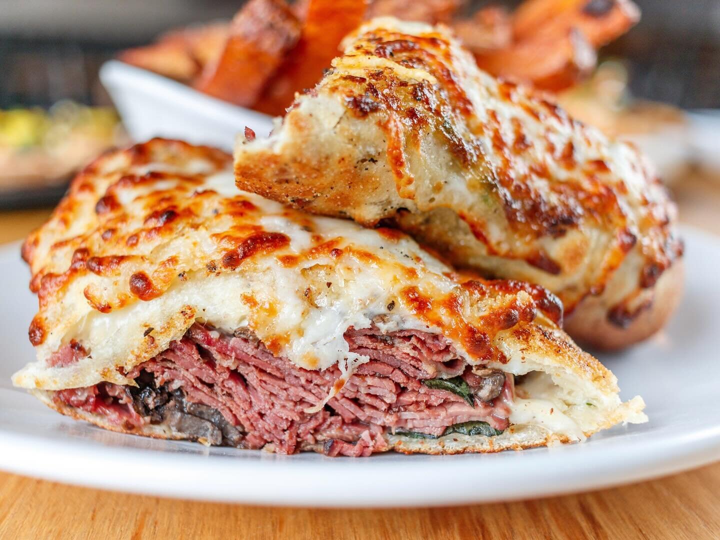 🌧️☔ Indulge in the ultimate rainy day comfort with our Stramrolie at Scout&rsquo;s Pub! 🍽️ Picture this: savory smoked pastrami, parmesan, mozzarella, basil, mushrooms, and garlic aioli, all wrapped up in a Cajun pizza crust, served with a side of 