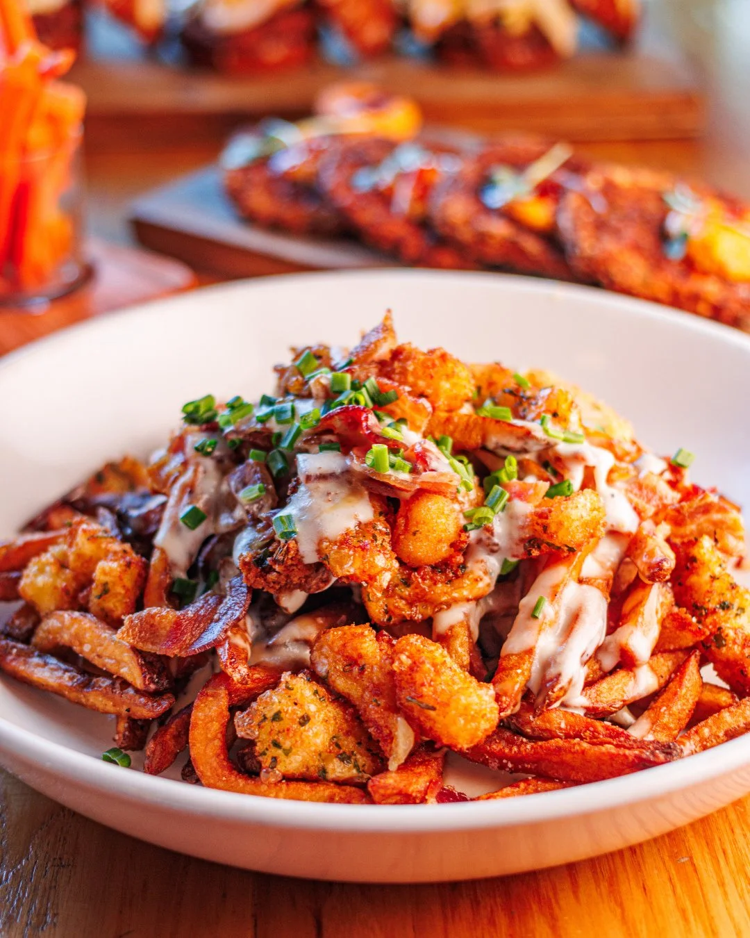 Fork &amp; Knife Fries &mdash; and yes, you&rsquo;ll want both.⁠
⁠
House-made fries loaded with fried cheese curds, sharp cheddar sauce, white bacon gravy, and ranch for dipping to create the most decadent Southern poutine.