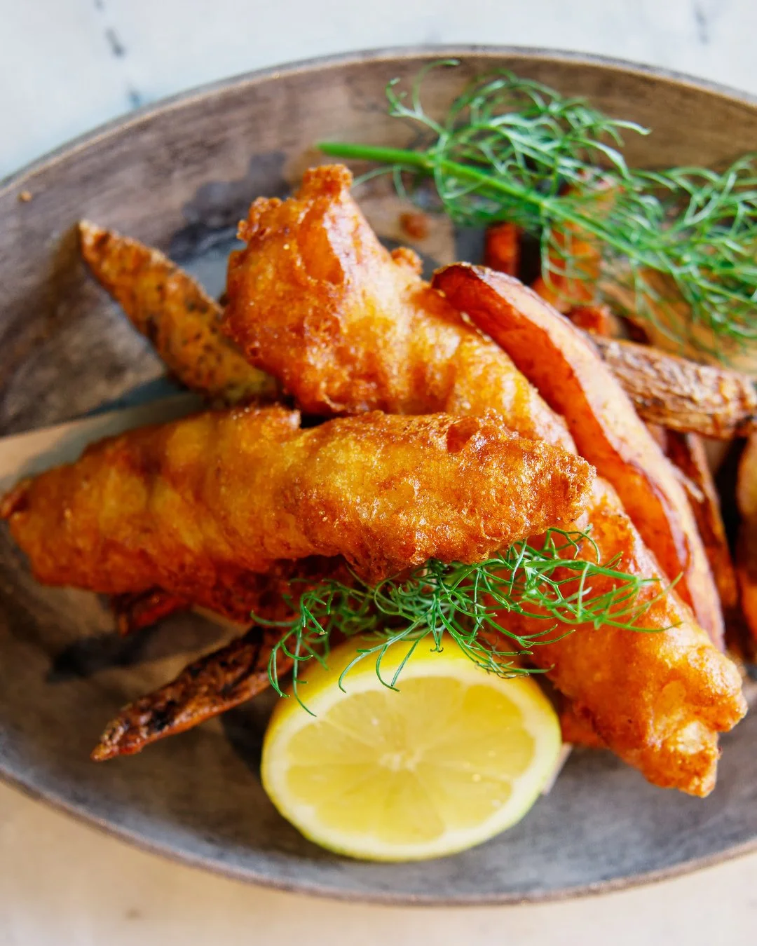 Golden, crispy and made for dipping. ⁠
⁠
Our Fish &amp; Chips features Puckett's Brew-battered haddock, pub fries, house-made tartar sauce and a squeeze of lemon for the perfect finish. ⁠
⁠
Stop by and give it a try this week. 🍋🐟