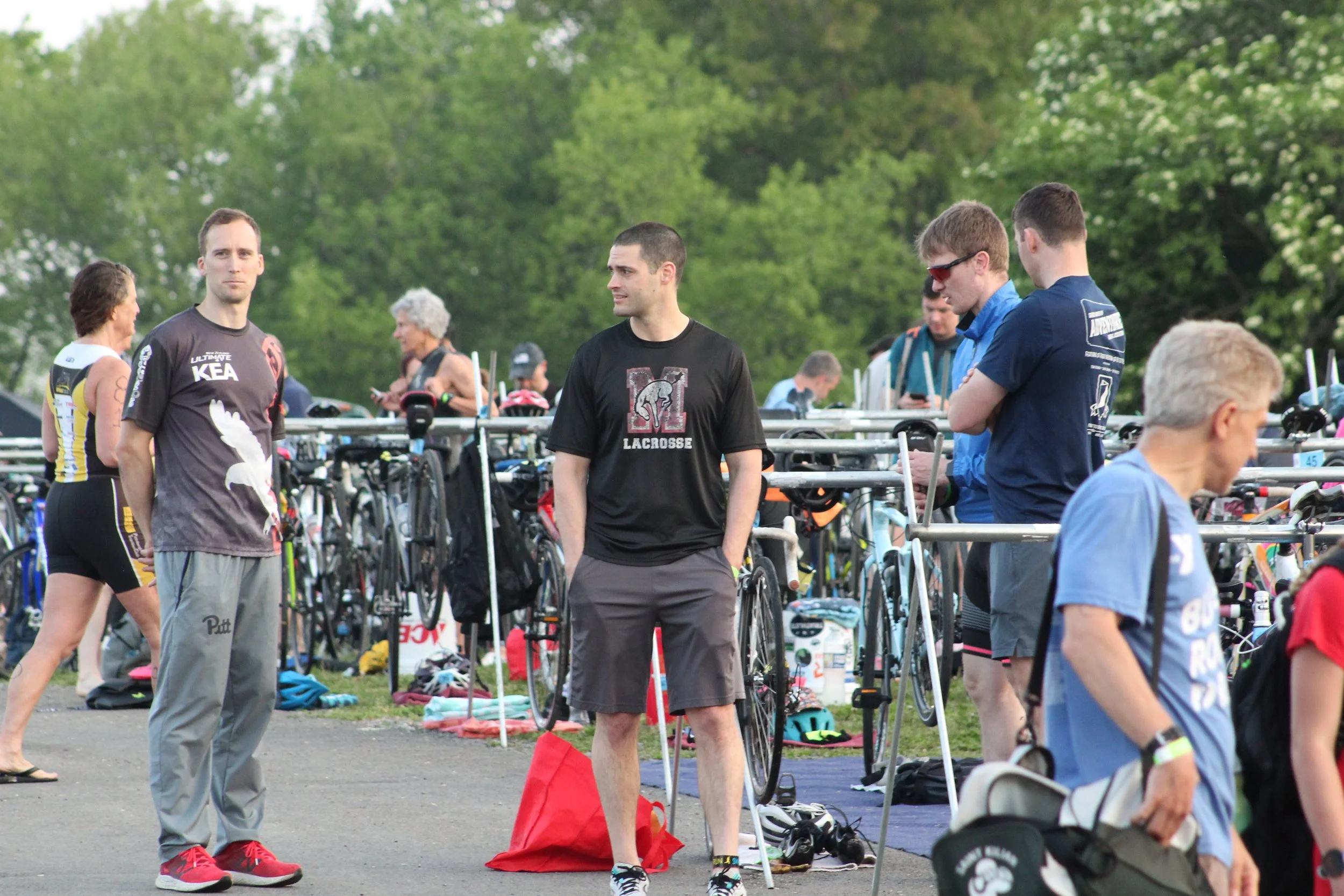 Athletes standing with their bikes in transition at Mighty Moraine