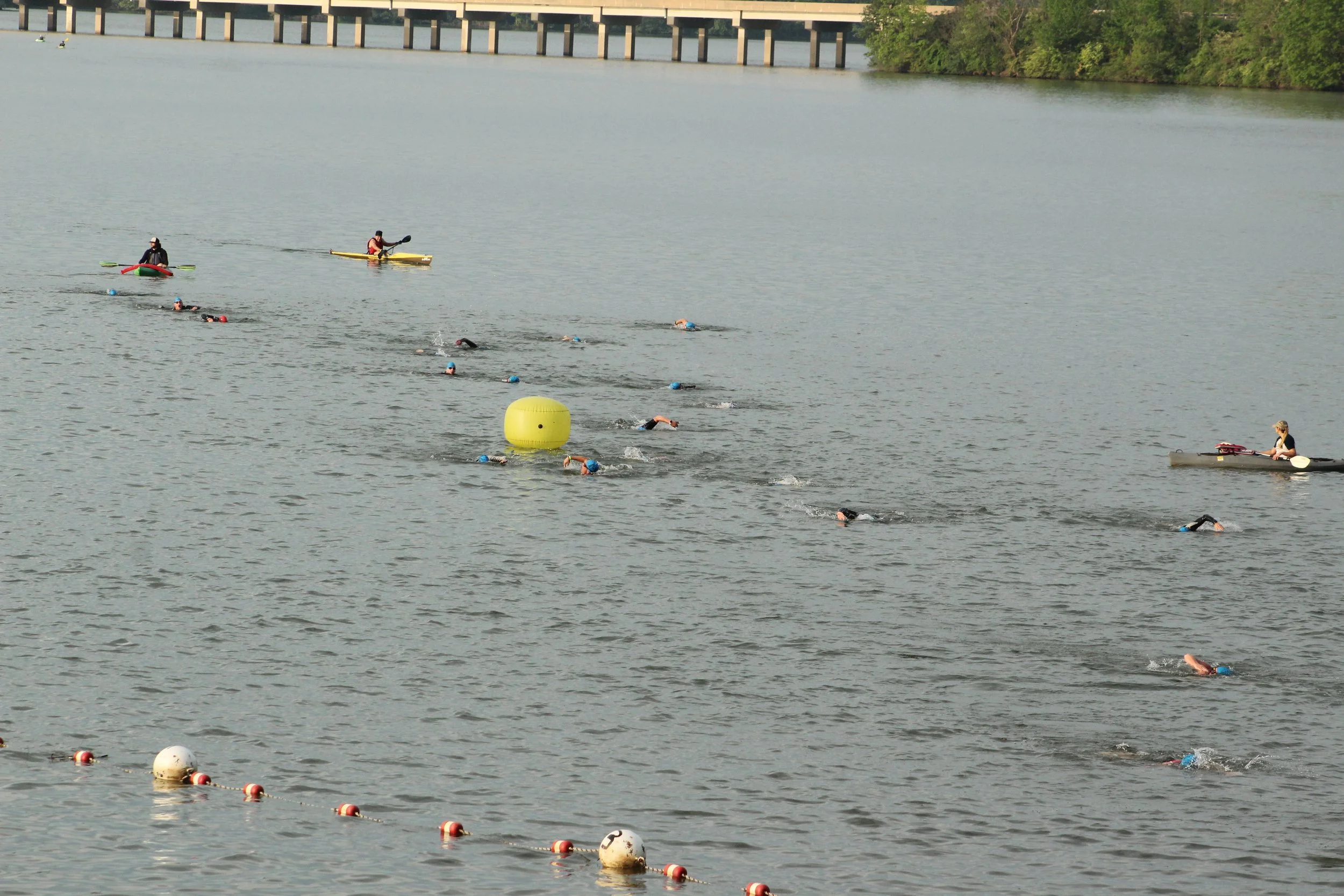Swimmers and kayaks on Lake Arthur during Mighty Moraine