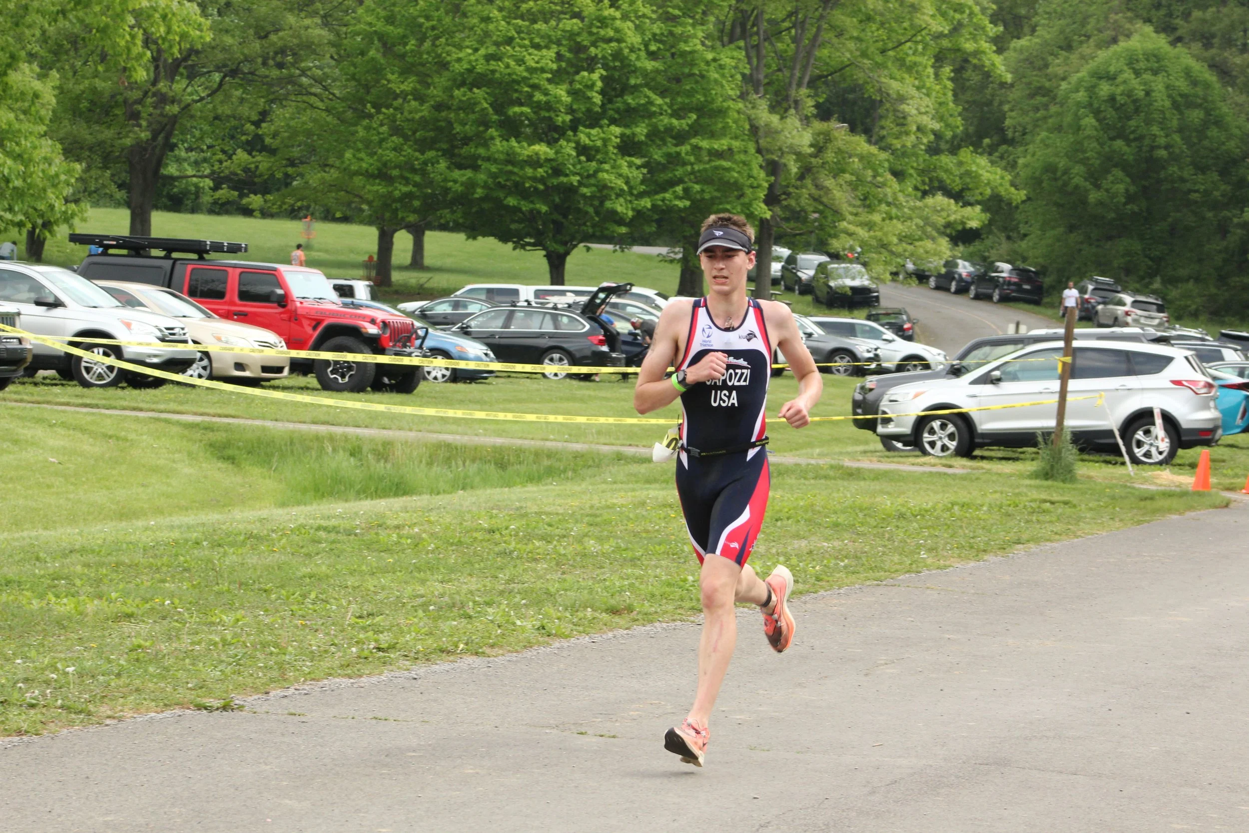 An athlete running the paved course