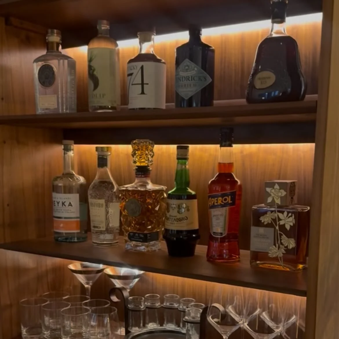 We had a project for a client to add lighting to this vintage piece by Kipp Stewart. We wanted to add the lights but keep them hidden. We created a master plan that included adding custom walnut pieces to hide the electrical work. We ❤️ how it came t