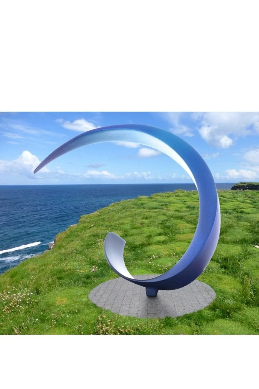 Torque V sculpture sandra bell irish cast bronze physics force circular motion abstract expression speed balanced base curl wave breaking magnetic water feature garden modern art sustainable