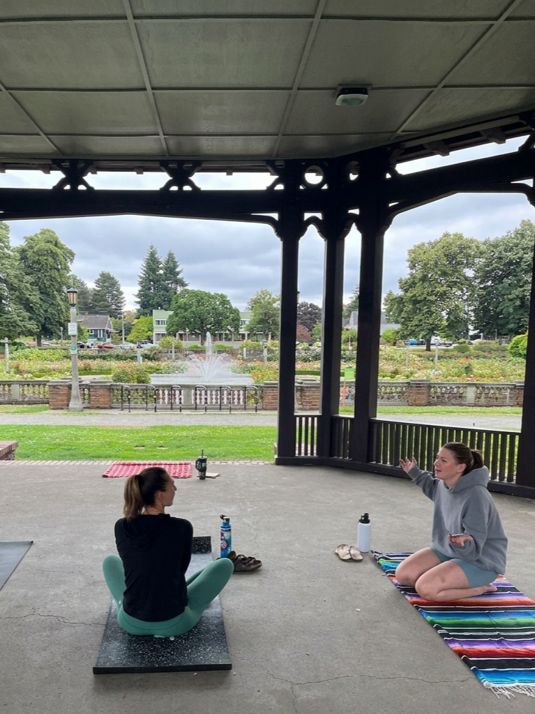 Community picnic and outdoor yoga event in Portland
