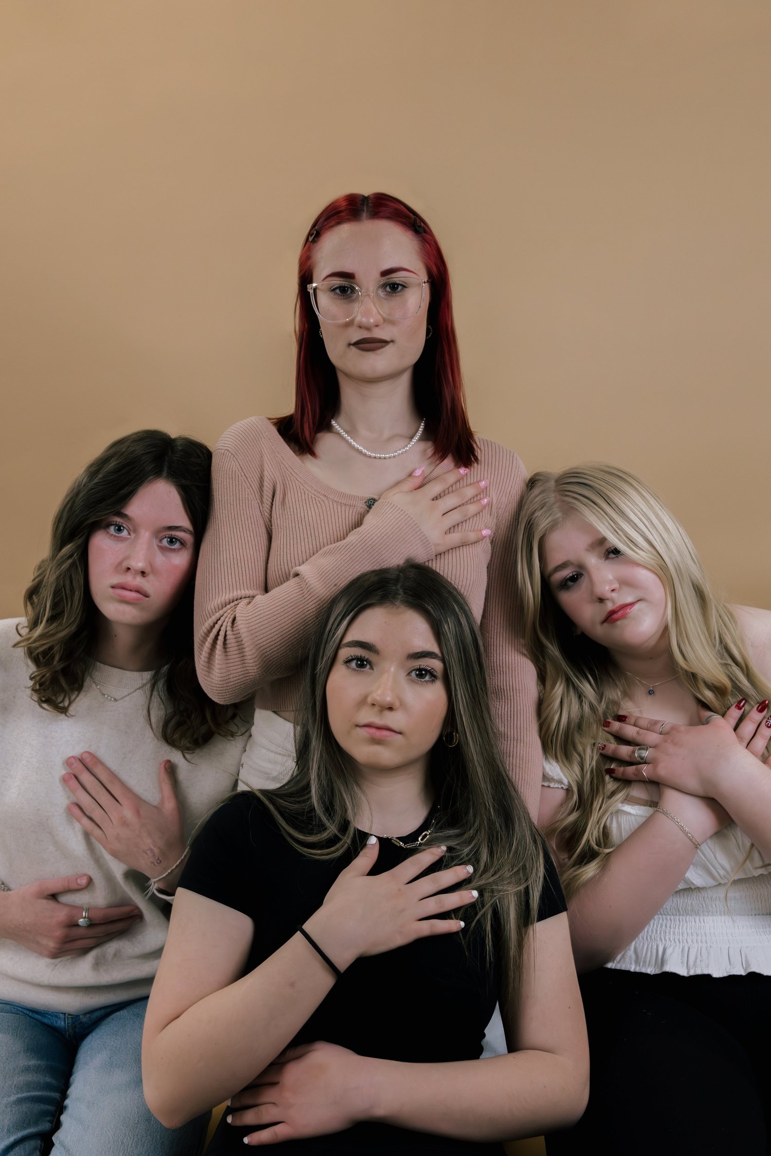 A group of girls standing close together