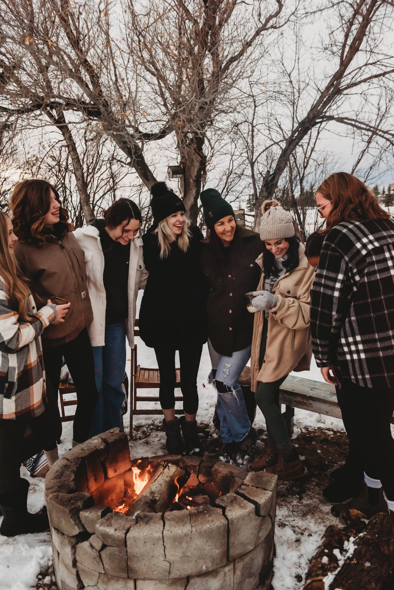 A group of women walking outside together in winter