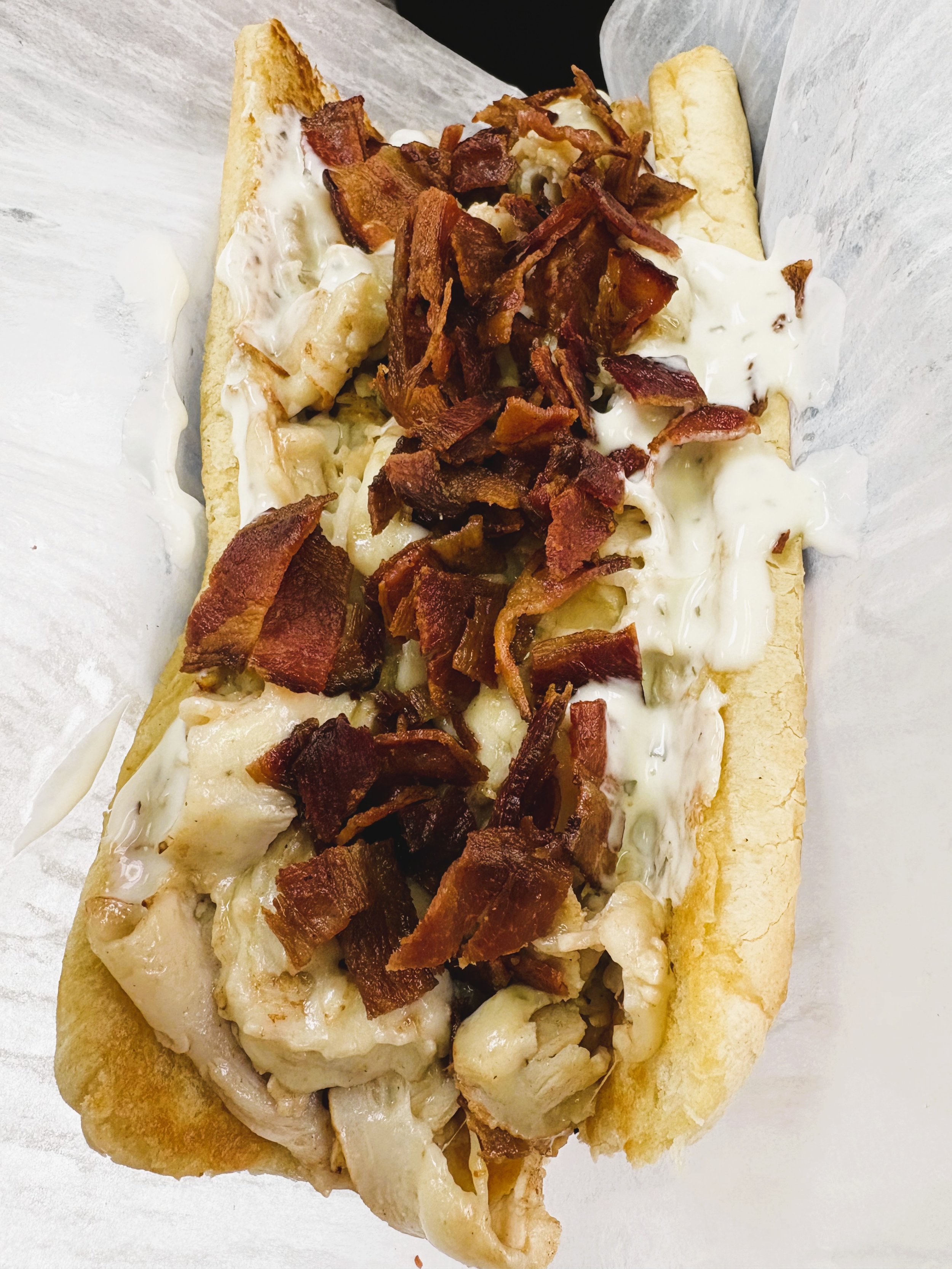 Chopped Turkey Bacon Ranch
Yowza! Try out this perfectly seasoned chopped sub with turkey, bacon, ranch, cheese of your choice, on a toasted sub bun. You won't be disappointed in this monster of a sub.