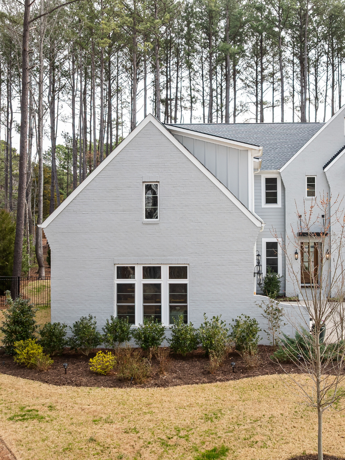 Home surrounded by pine trees in a mountain setting