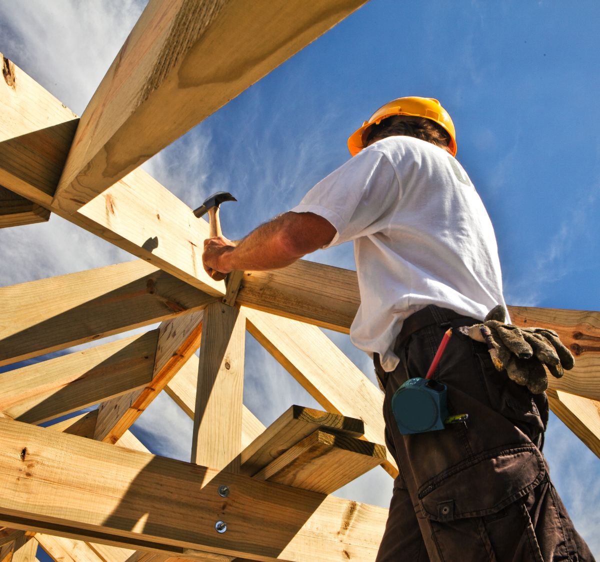 Contractor working on the wood framing of a new home