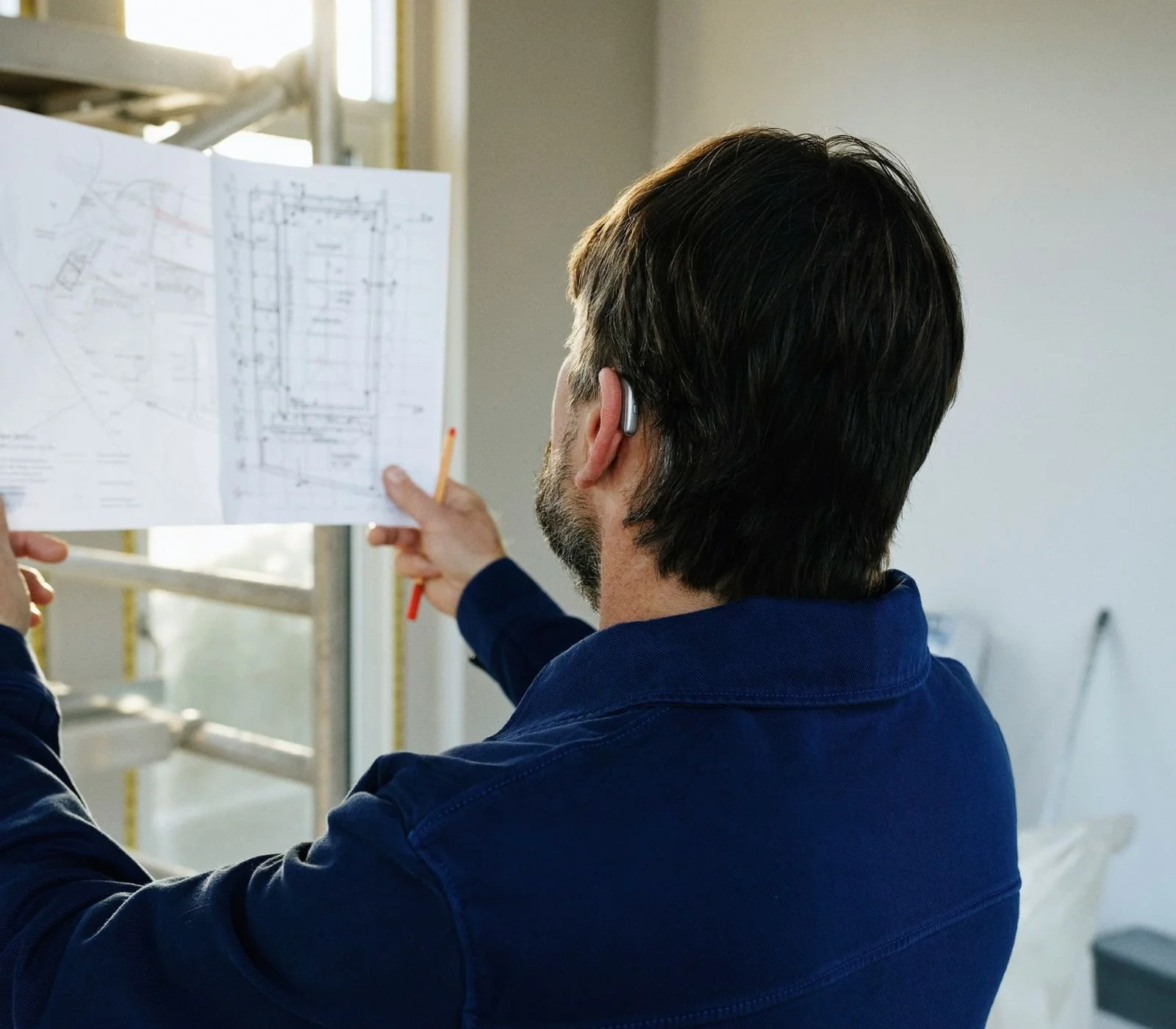 Professional reviewing site plans for an Arizona septic permitting project.