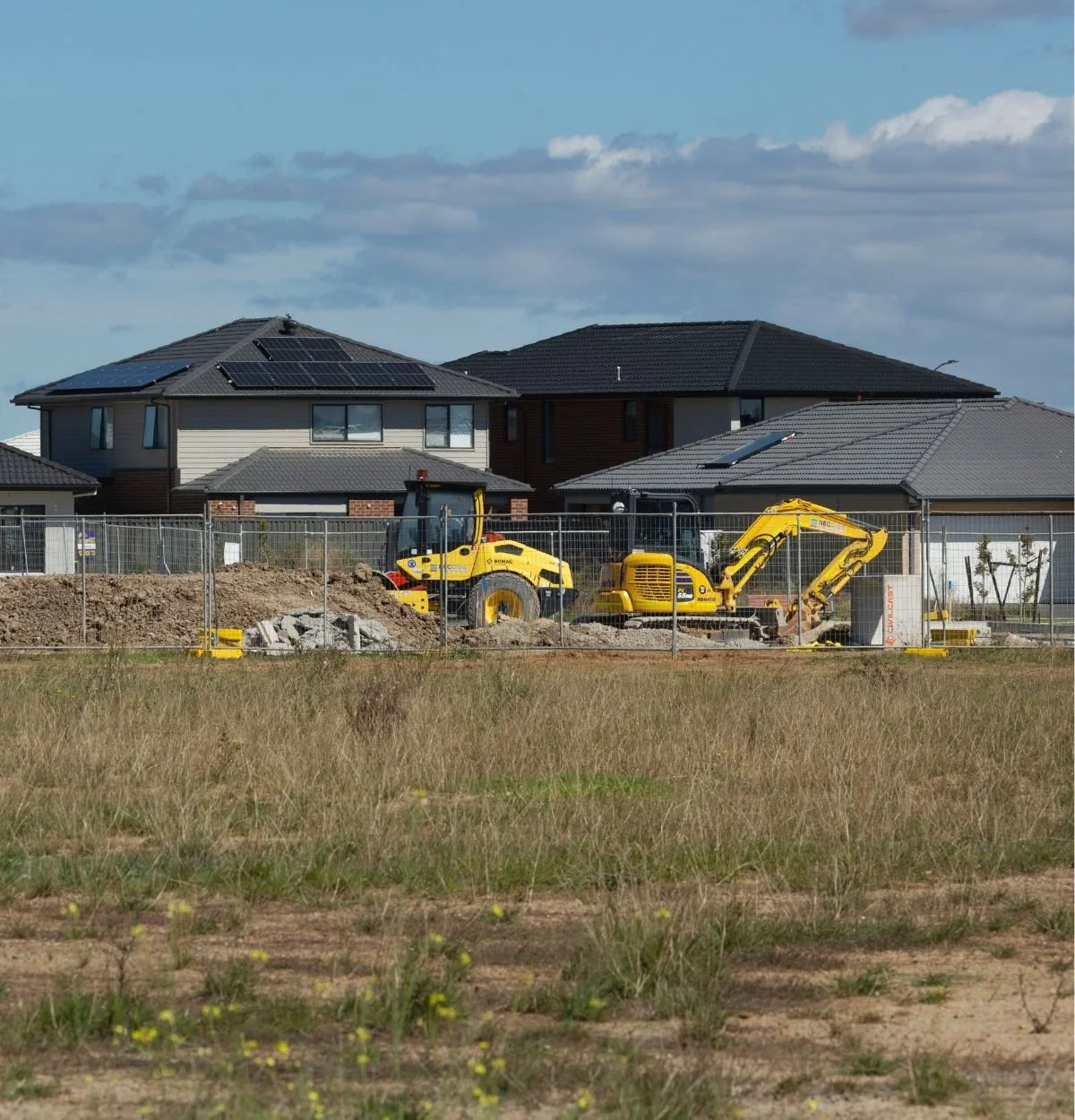 Excavation equipment working at a residential construction site