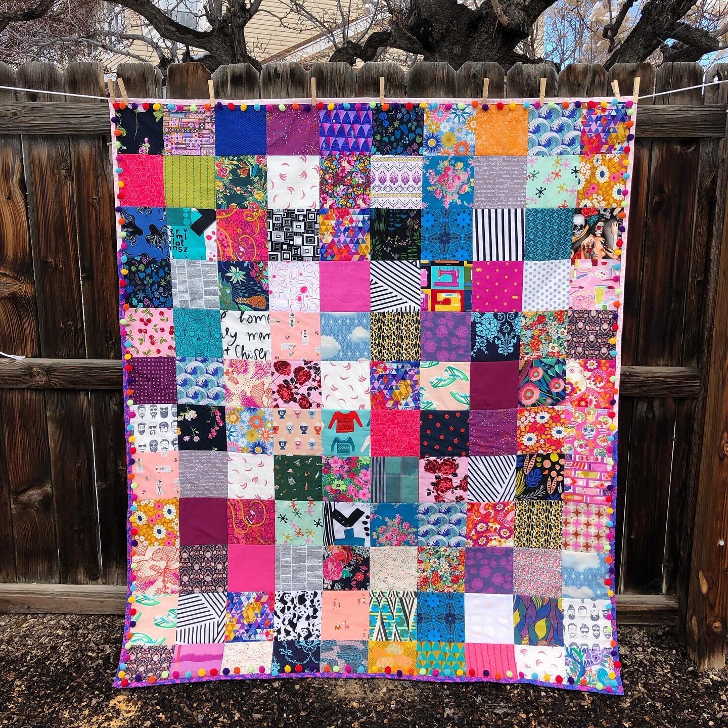 Tank stole the minky blanket I was using on the couch the other night so I busted this quilt out of the cabinet and figured it was worth a reshare.

This was the first quilt that I put pom pom trim on. I made it in February 2019 so it has been used a