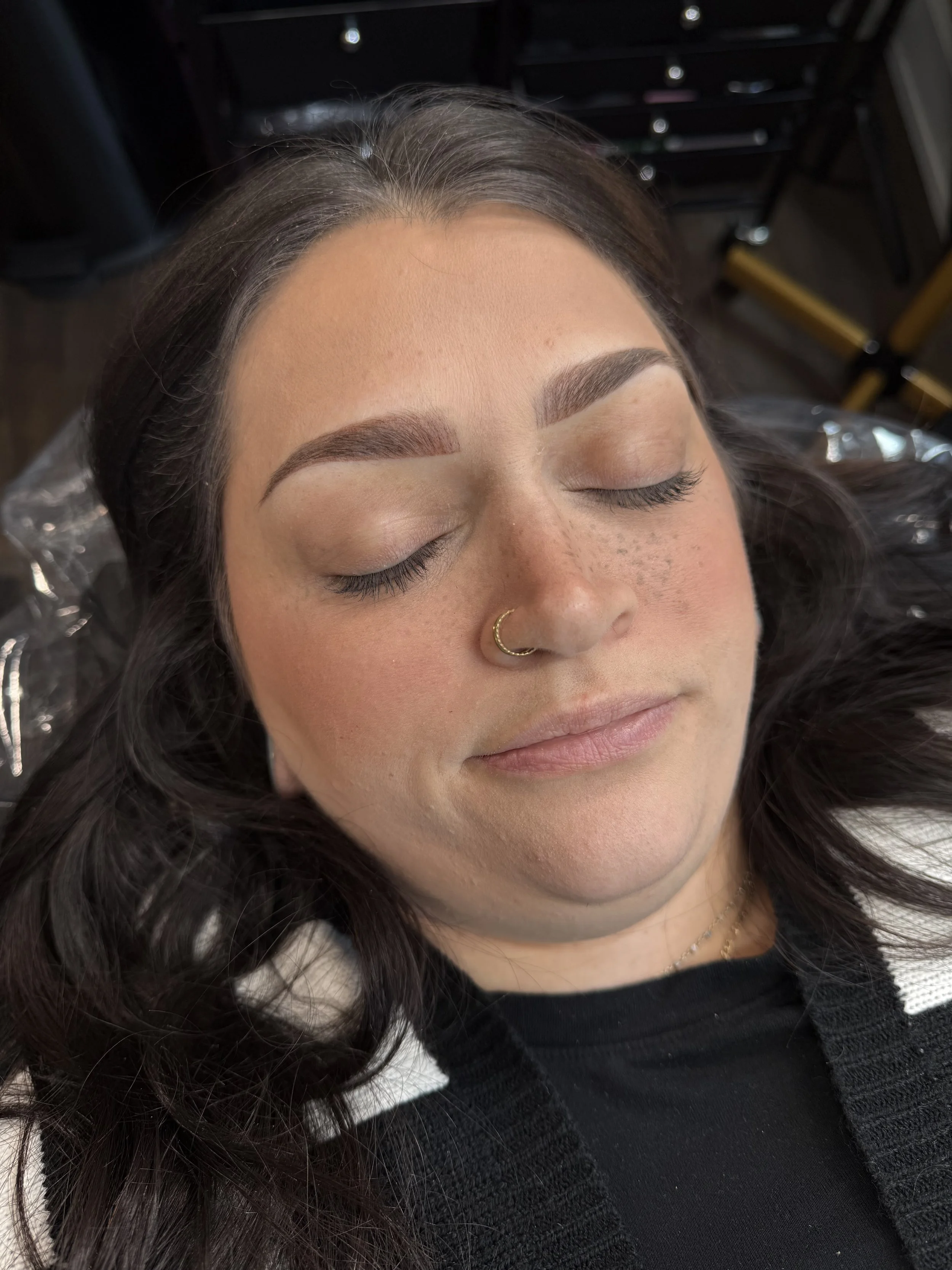 Close-up of a person's eye area showing before and after Permanent Makeup. Powder Brows. Nano strokes. Fairfax permanent makeup artist.